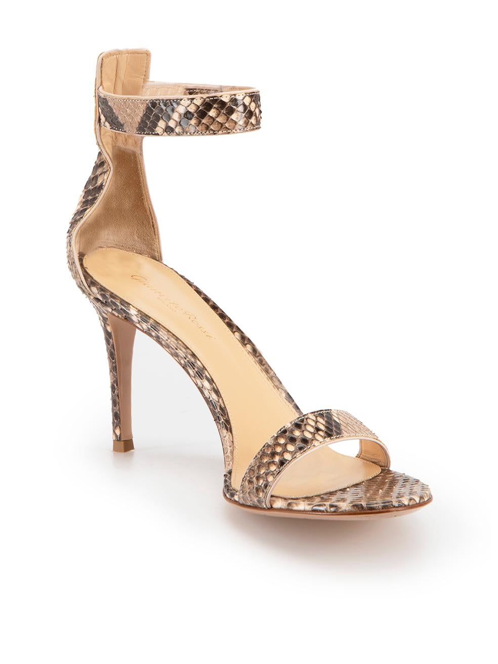 CONDITION is Very good. Minimal wear to sandals is evident. Minimal scuffing seen on sole with minor creasing of upper on this used Gianvito Rossi designer resale item. Comes with dust bag.



Details


Brown

Snakeskin

Heeled sandals

Mid