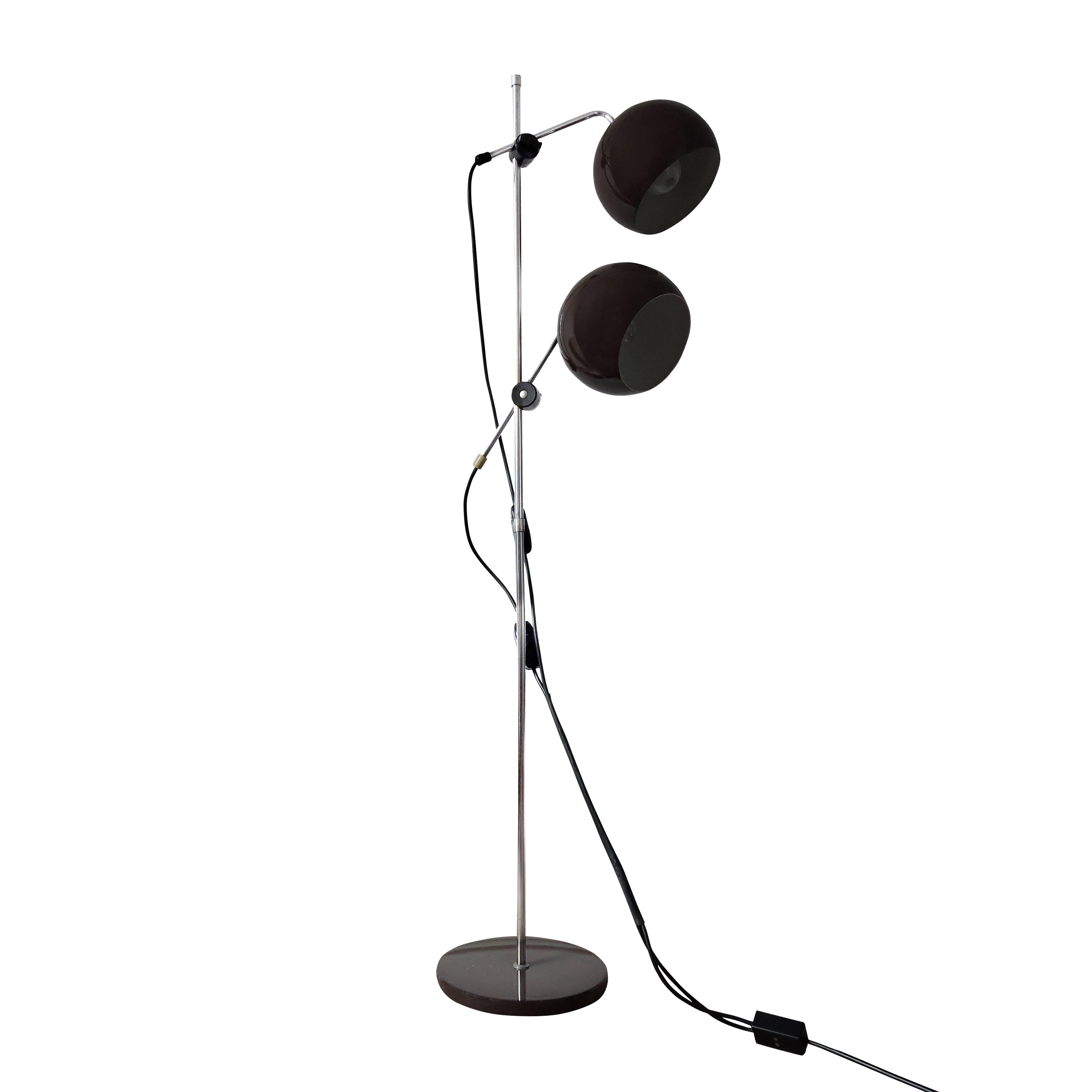 This floor lamp features two shades that can be turned in different directions.