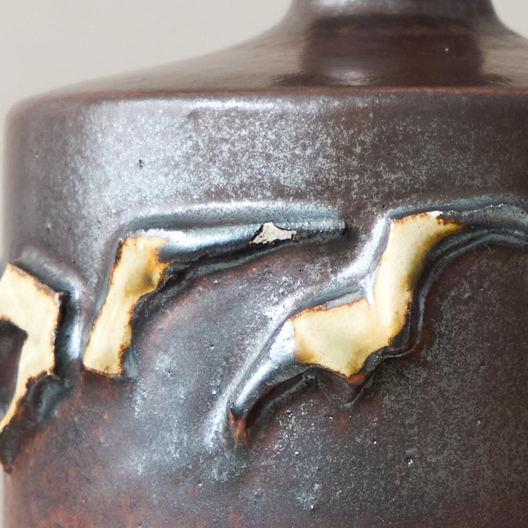 A beautiful stoneware vase with amazing glaze. 
Made by Claes Thell, in the artist's studio, Höganäs, Sweden, 1983.

Signed Thell '83. Fair condition, it has a chip (pictured).

Claes Thell is a Swedish ceramicist known for his intricate and