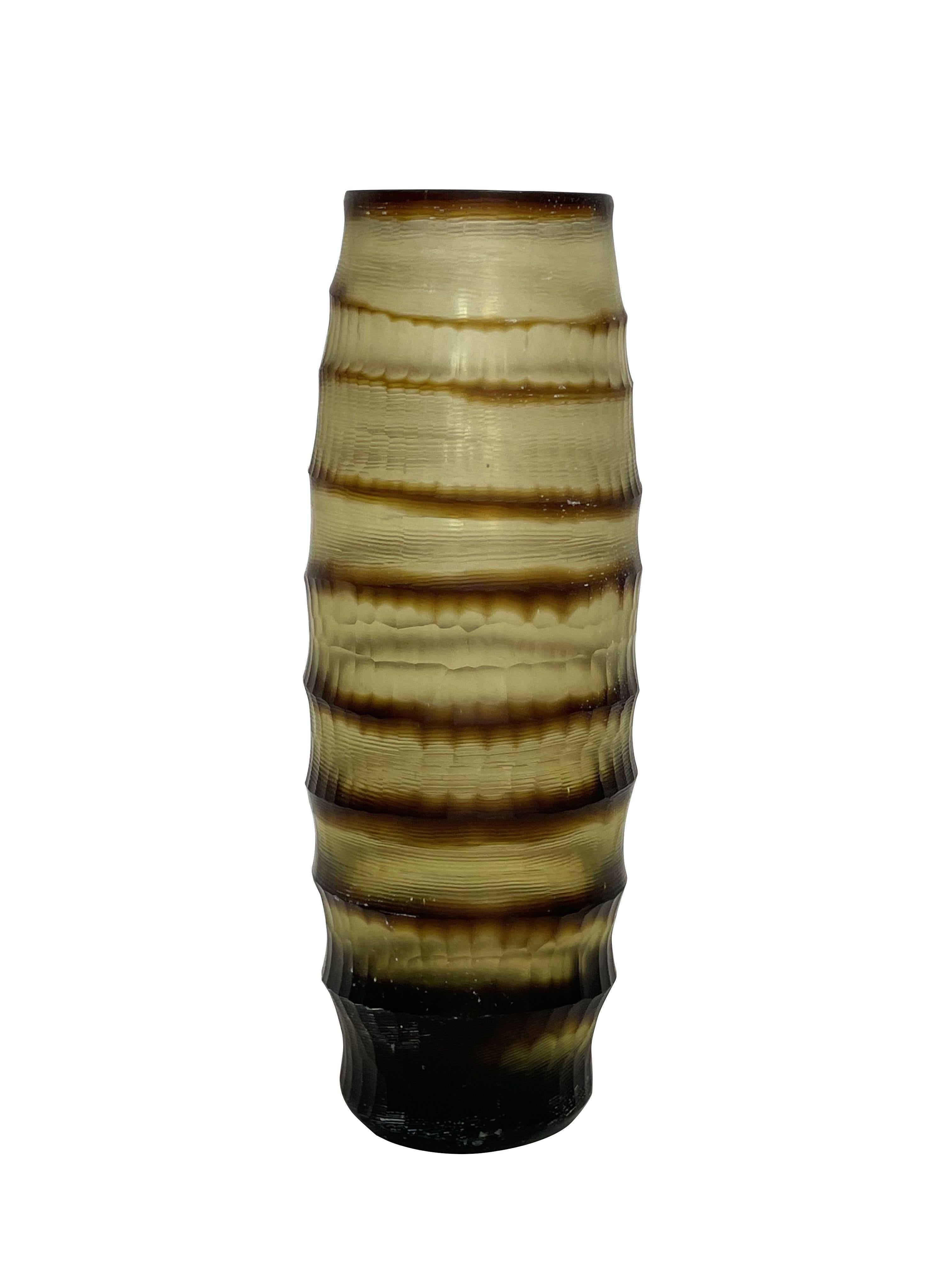 Contemporary Romanian horizontal ribbed and striped brown glass vase.
Tall cylinder shape.
Sits well with shorter version S6113.