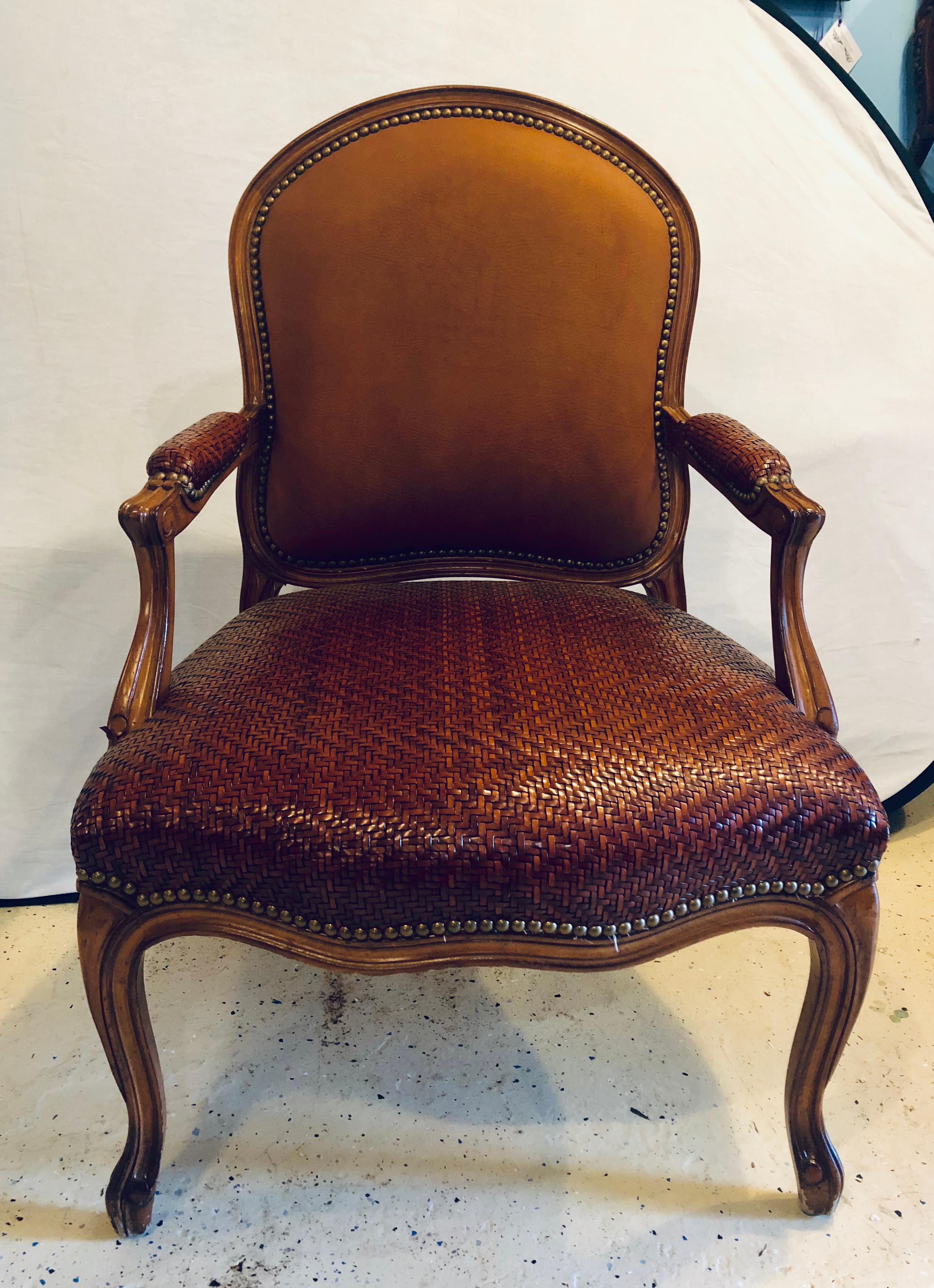 Brown suede and tweed leather bergère armchair by Brunschwig & Fils. This rarely ever sat in bergère armchair by Brunschwig and Fils is simply stunning and certain to make any room in the home or office stand out. The suede back compliments the