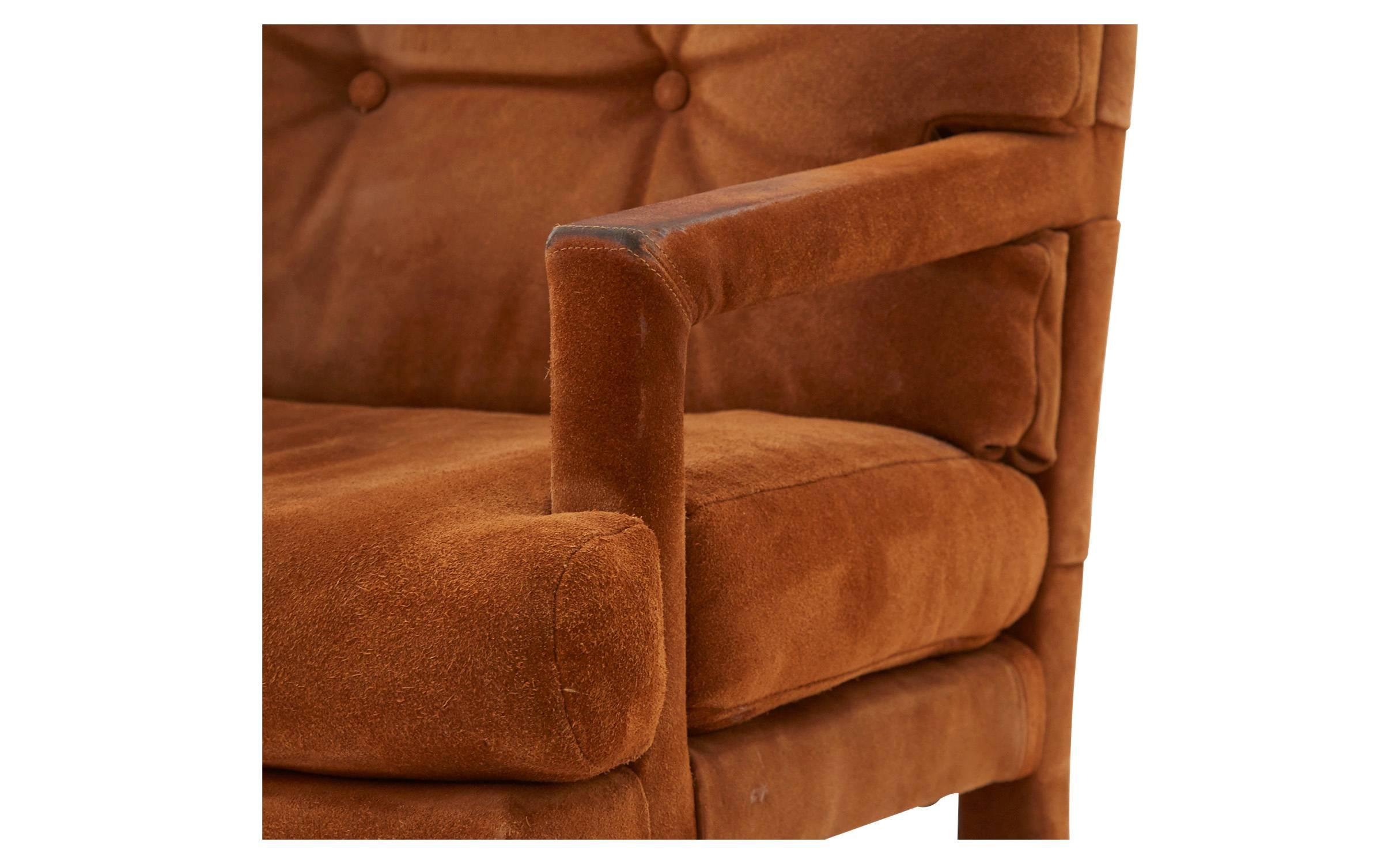 • Original brown suede upholstery with a tufted back
• 20th century
• American

Dimensions
• overall 24' W x 28' D x 35' H 
• seat height 19.5' H 
• arm height 25' H.
