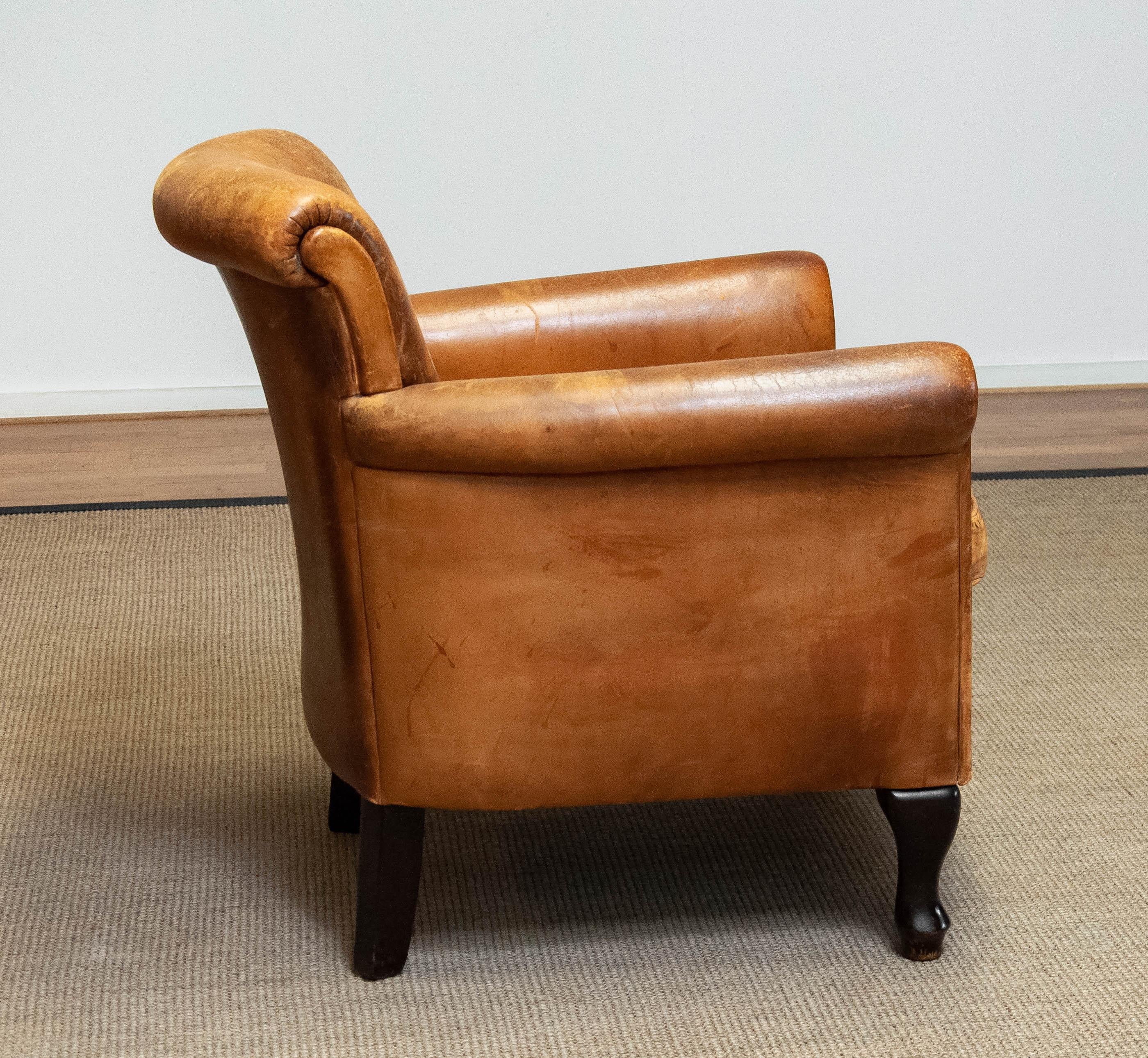 1960s Brown / Tan French Art Deco 'Sheep' Leather Roll Back Lounge / Club Chair In Good Condition For Sale In Silvolde, Gelderland