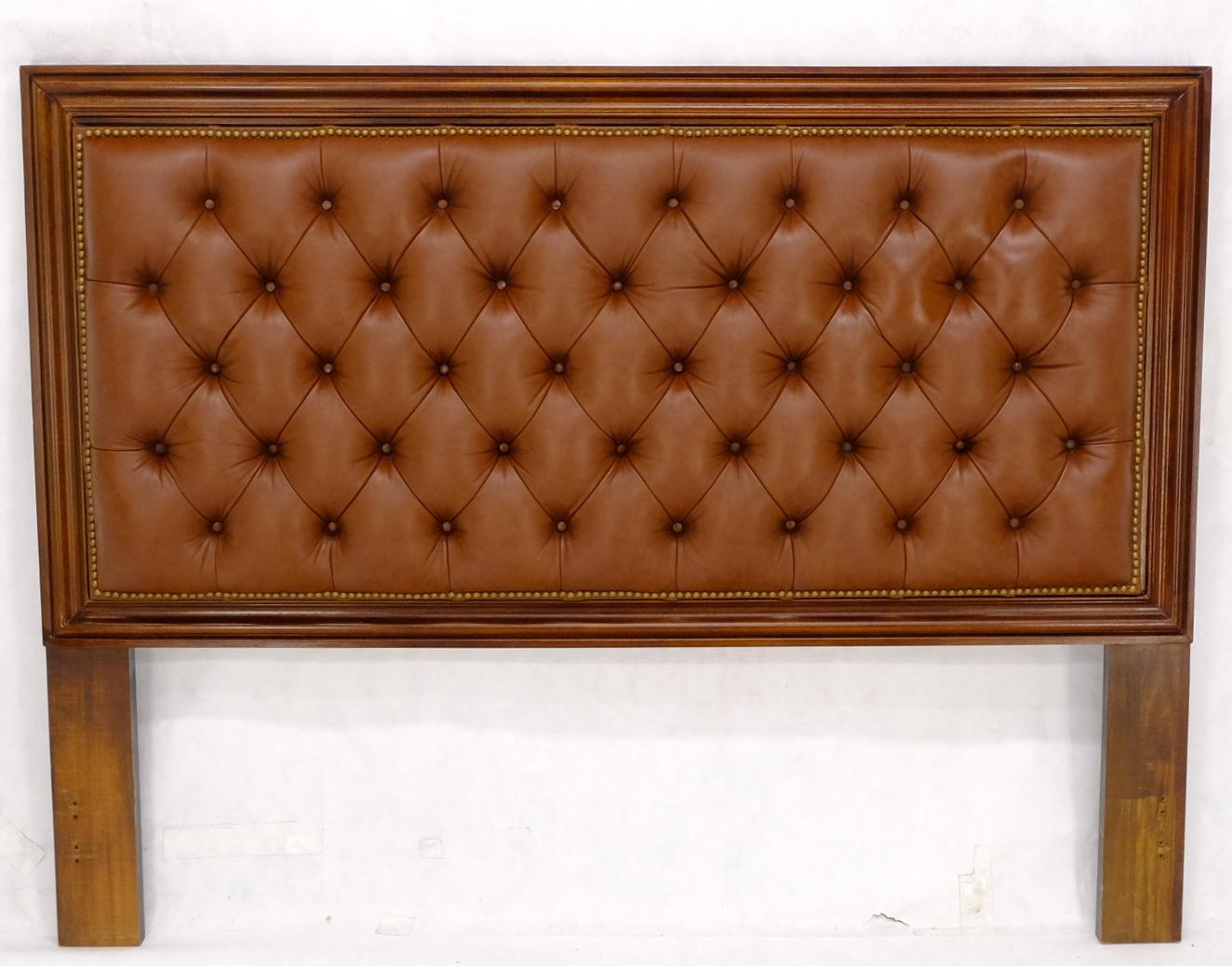Brown to tan tufted leather custom Chesterfield headboard.