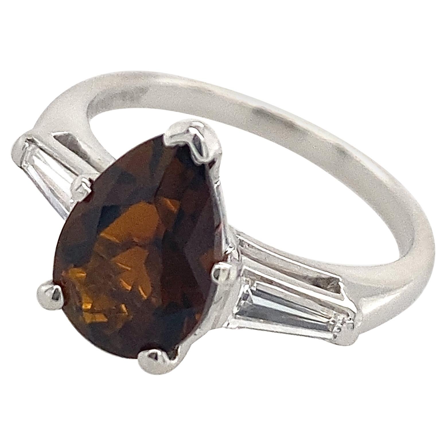 Platinum 3-Stone Ring with Long Diamond Baguettes & Brown Tourmaline Pear