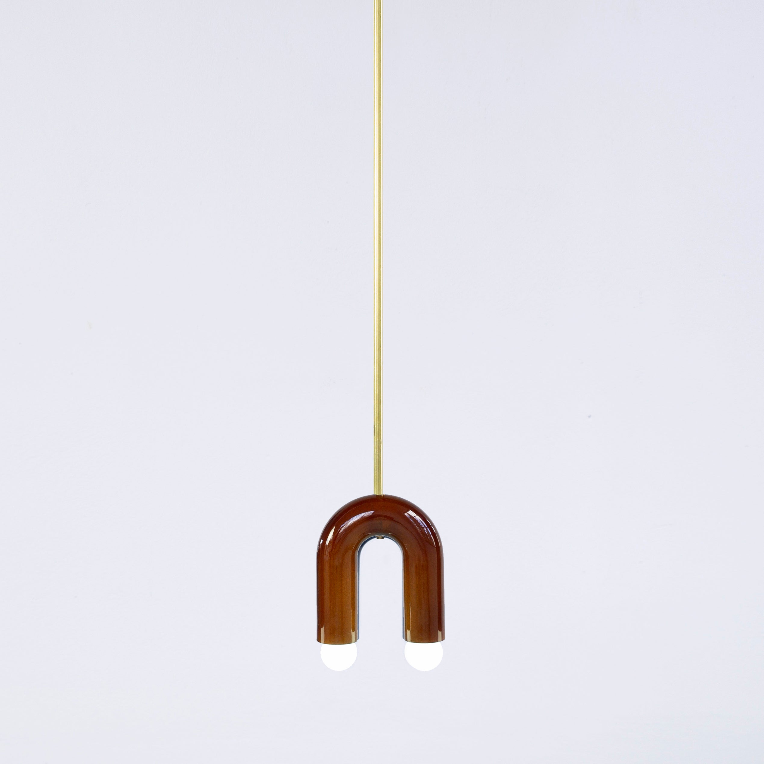 Cobalt TRN A1 pendant lamp by Pani Jurek
Dimensions: D 5 x W 15 x H 18 cm 
Materials: ceramic and brass.
Available in other colors.
Lamps from the TRN collection hang on a metal tube, not on a cable. This allows the lamp to be mounted in a specific