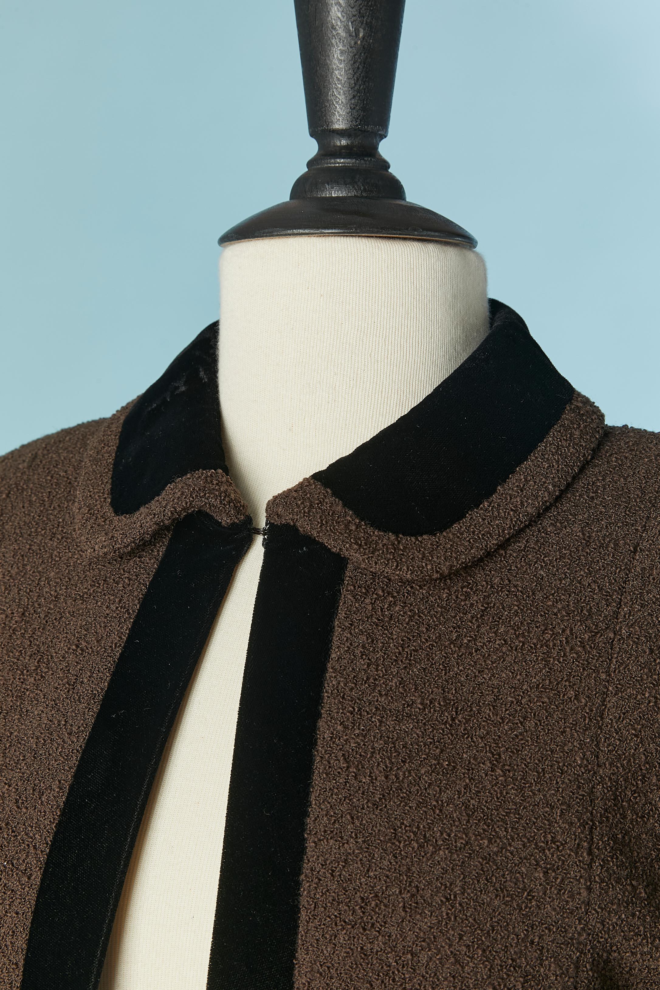 Brown tweed skirt suit with black velvet edge. Silk branded lining. One hook&eye closure on the top middle front. Chain inside on the bottom edge . Shoulder pad. Raglan sleeve. 
SIZE OF THE JACKET 36 (Fr)  S
SIZE OF THE SKIRT 34 (Fr) XXS 