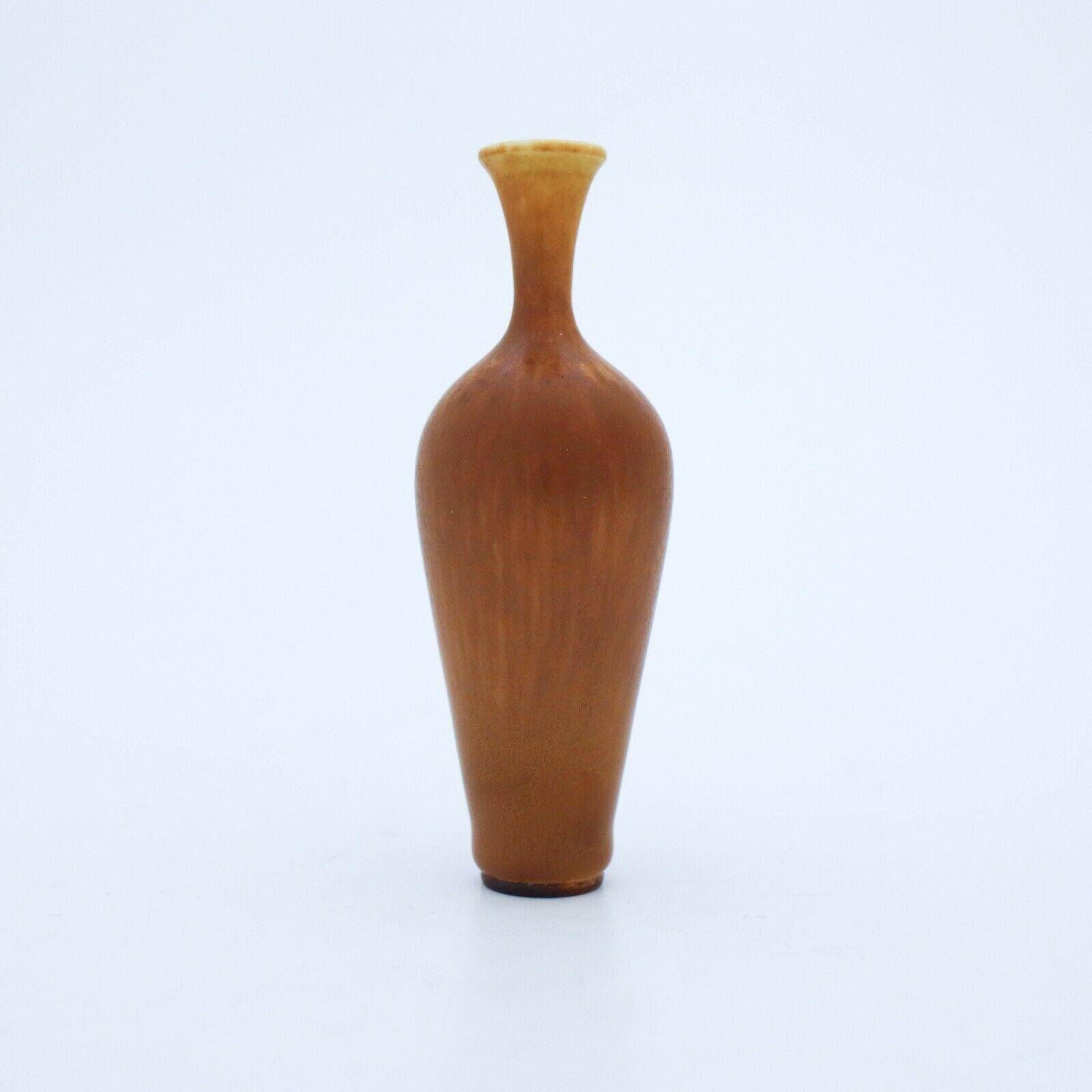 A brown vase designed by Berndt Friberg at Gustavsberg in Stockholm, the vase is 10 cm high. It ´s marked as on picture and was made in 1962, it is in excellent condition.