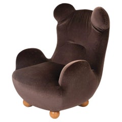 Brown velvet armchair attributed to Pierre Yovanovitch