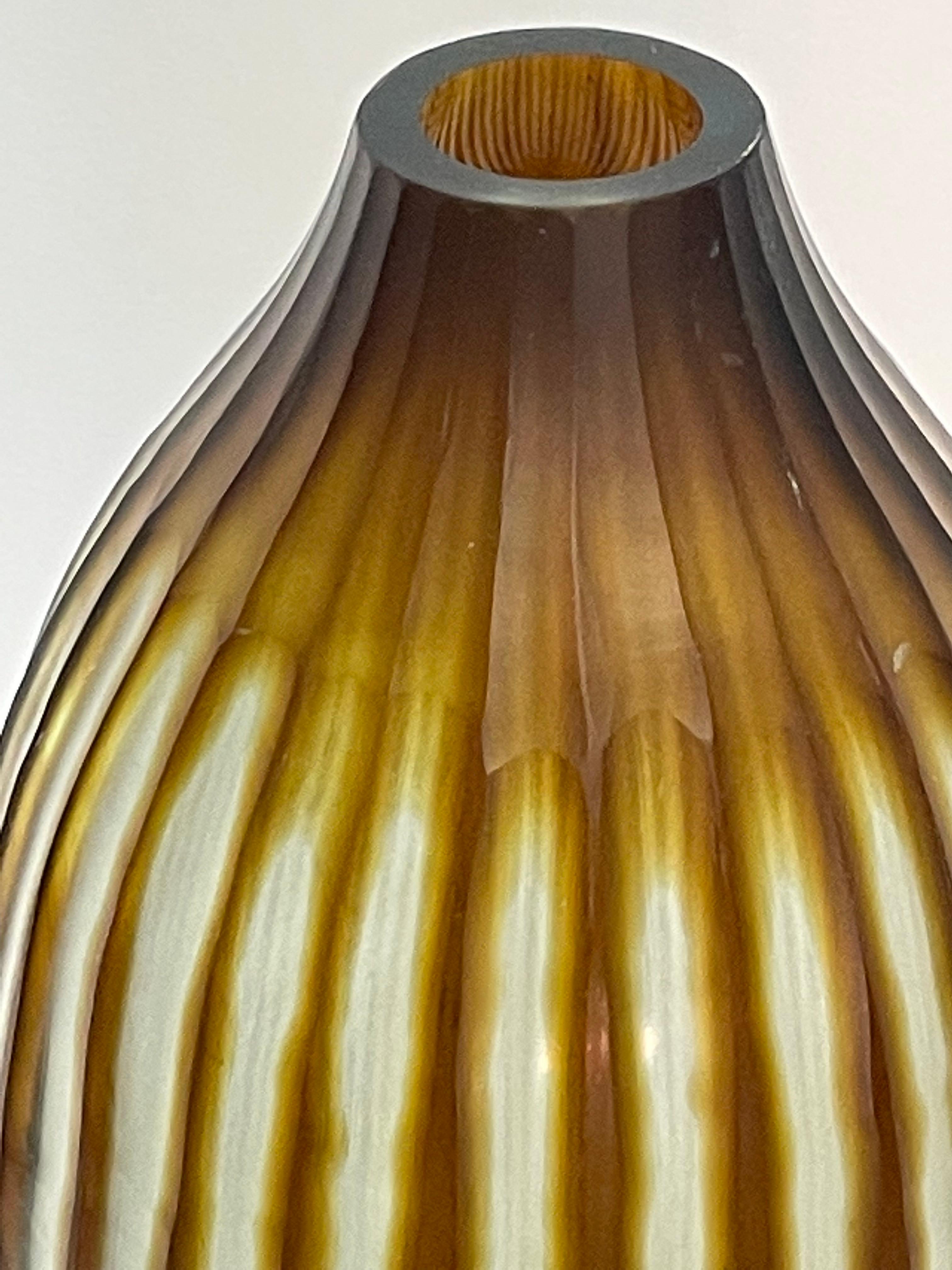 Contemporary Romanian vertical ribbed and striped brown glass vase.
Tall cylinder shape.
Sits well with taller version S6116.