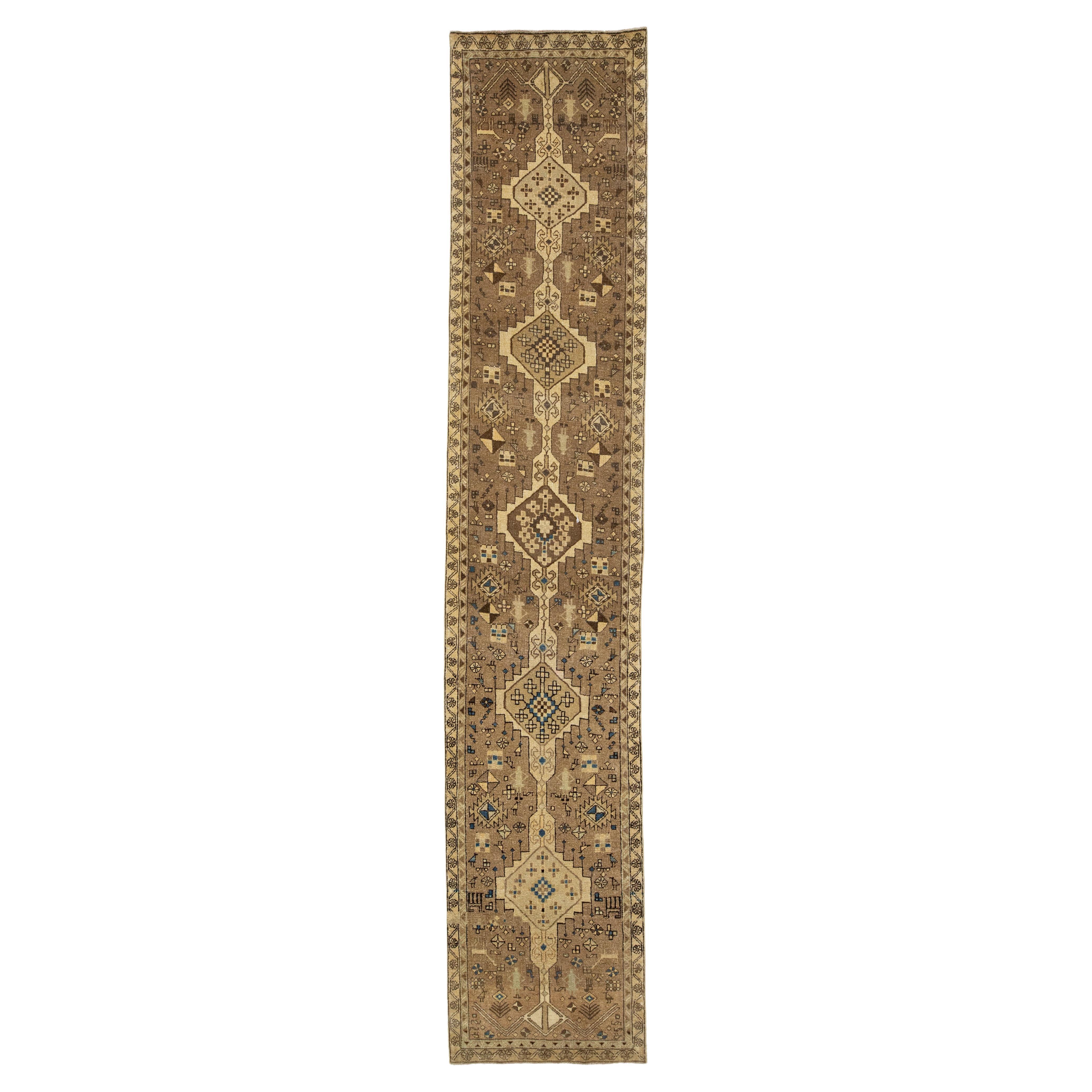 Brown Vintage Distressed Persian Wool Runner With Tribal Pattern For Sale