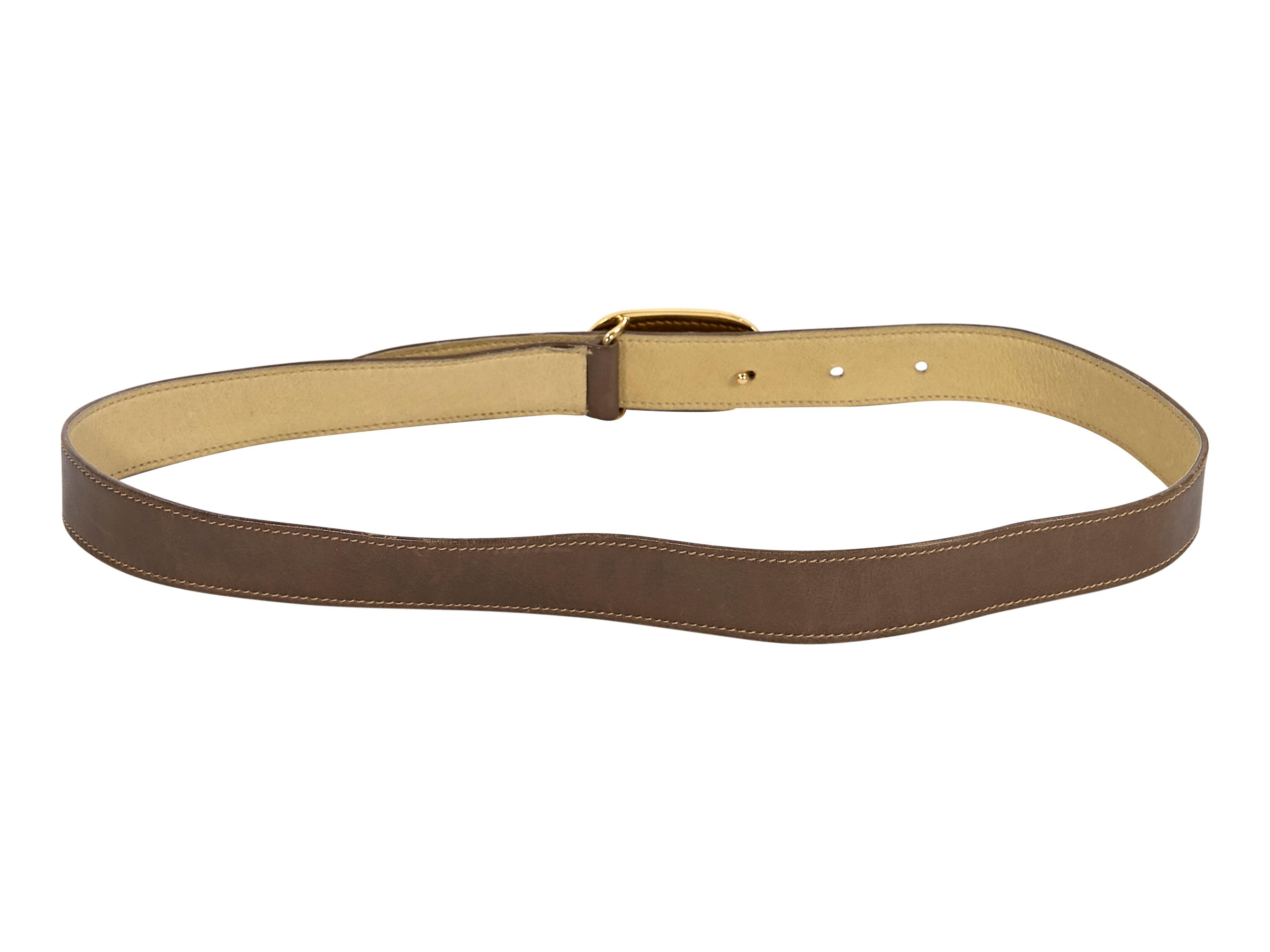 Product details:  Vintage brown leather skinny belt by Gucci.  Adjustable pin buckle closure.  Goldtone hardware.  25