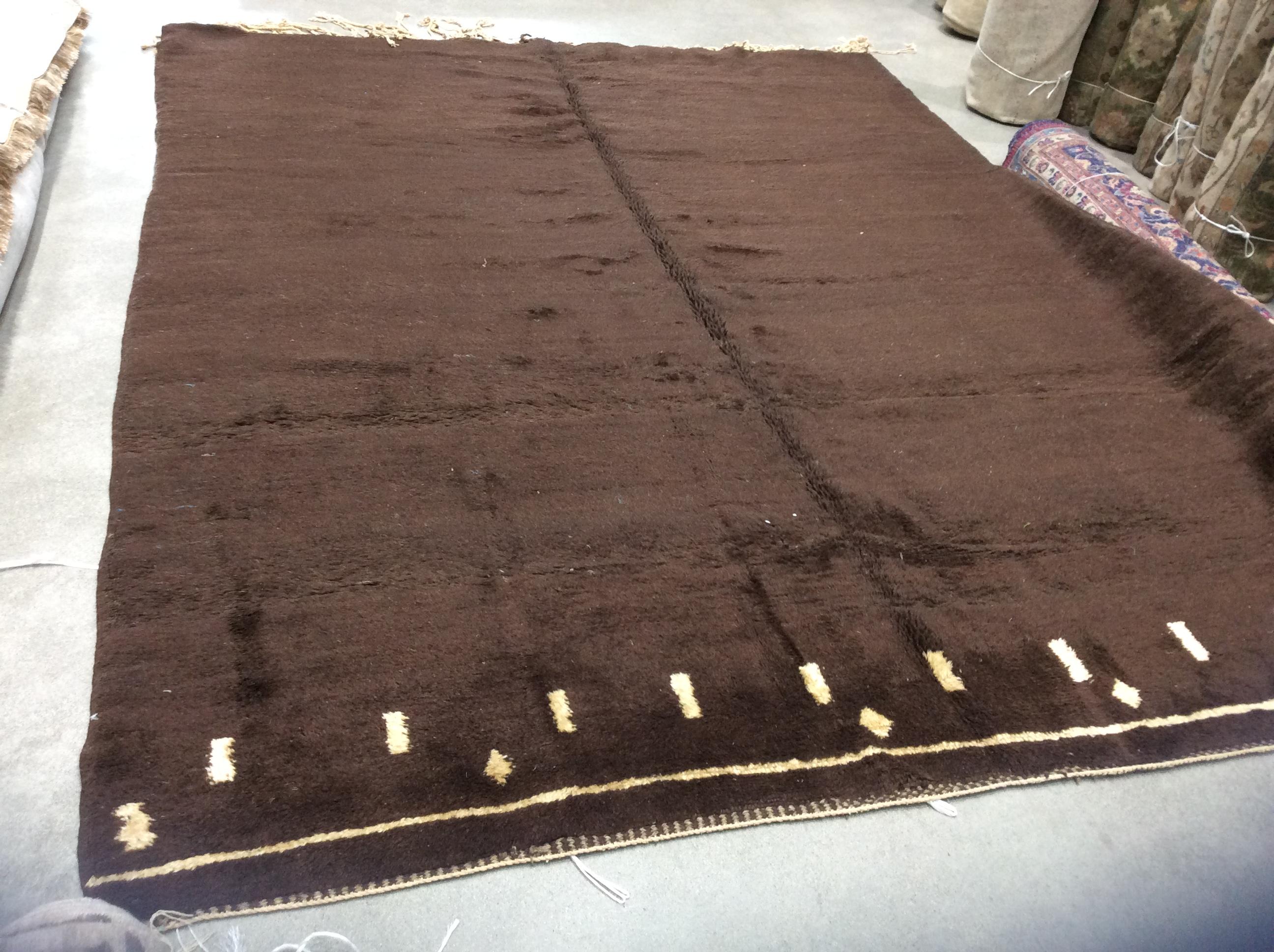 Brown vintage Moroccan rug.

