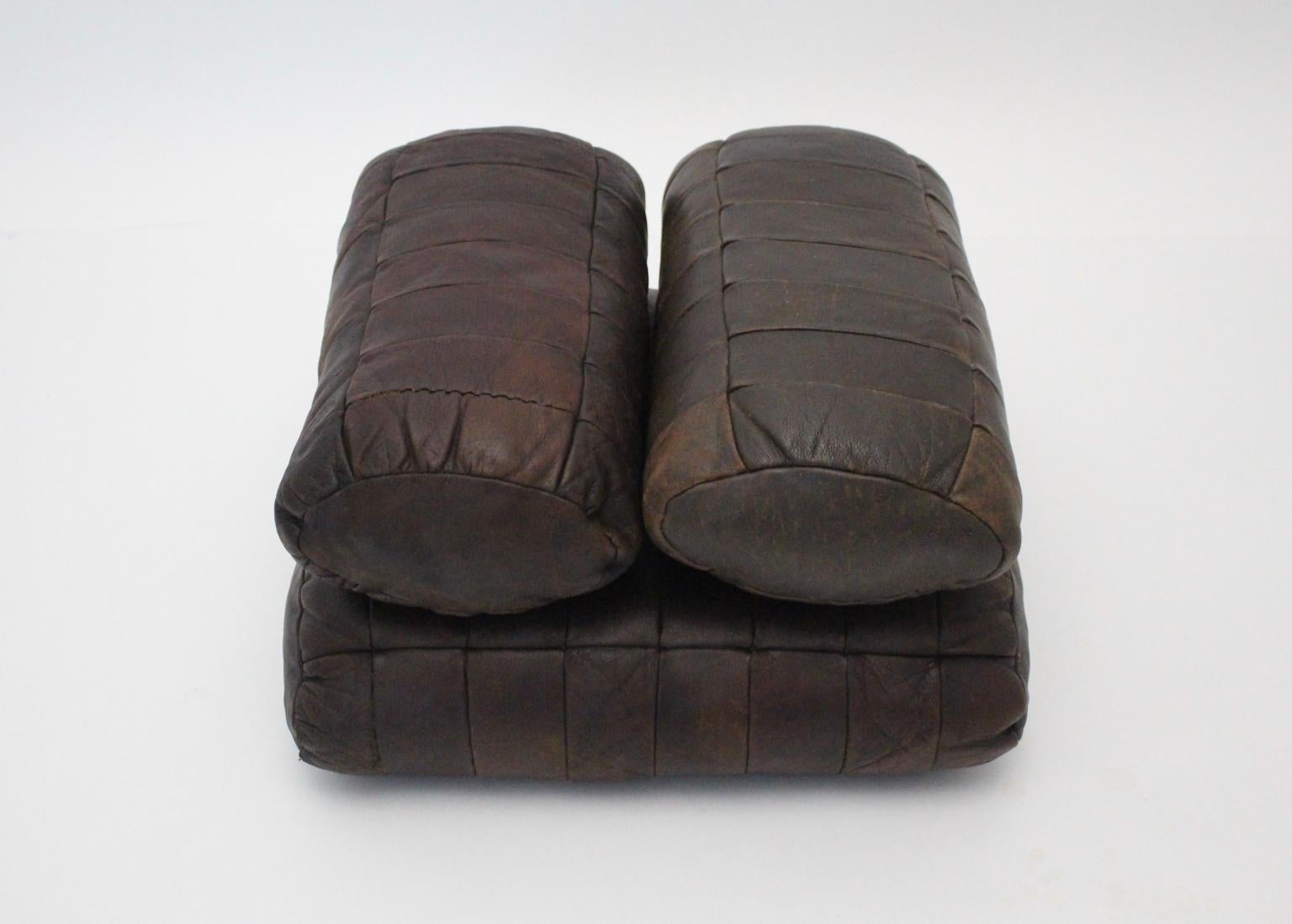 This set of four pillows by De Sede Switzerland, 1970s were made of chocolate brown leather stitched patchwork and features a great leather patina.
Also the condition is very good and shows signs of age and use.

Each pillow shows the approx.