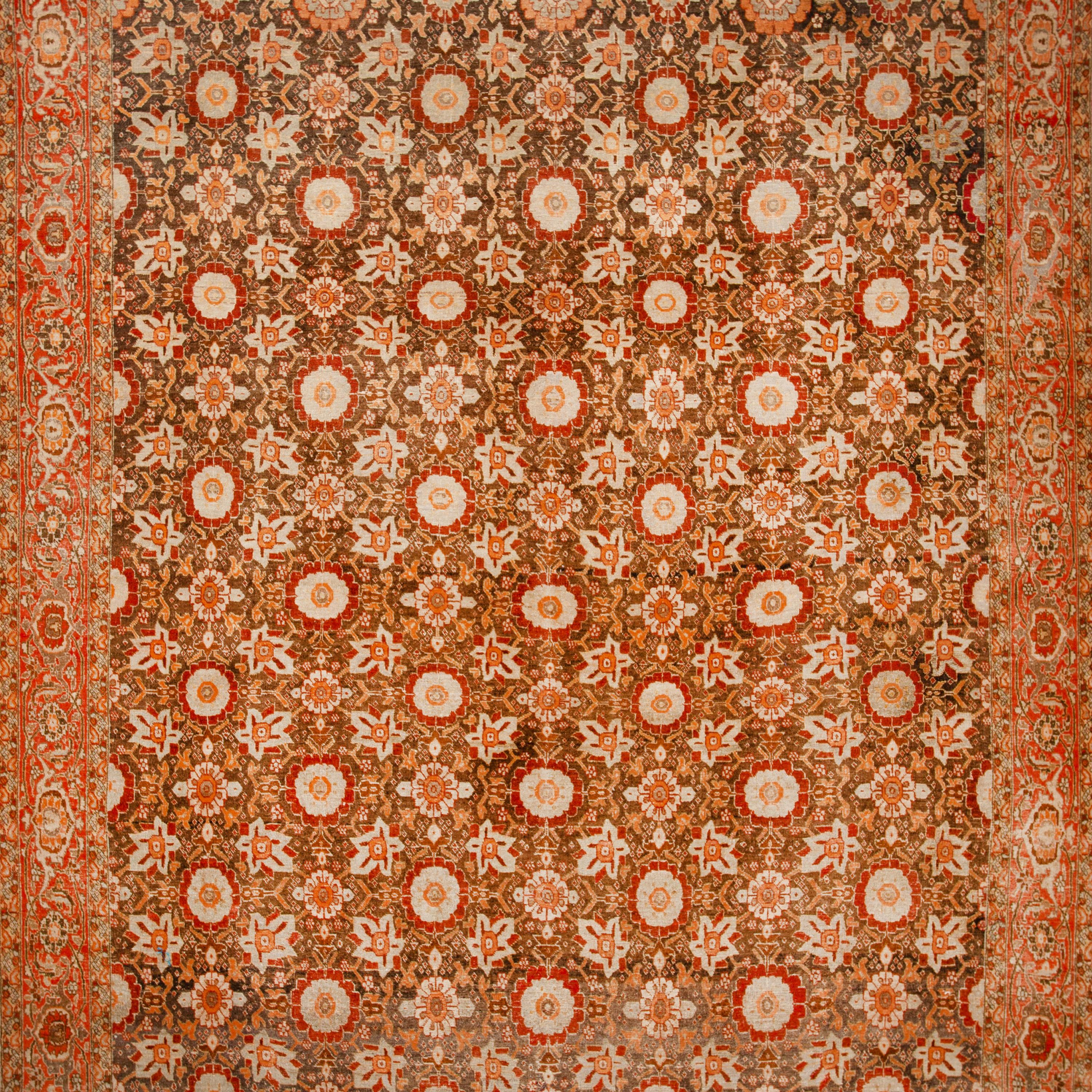 A rich earth-toned color palette and traditional motifs make this Brown Vintage Wool Malaya Persian Rug - 9'5