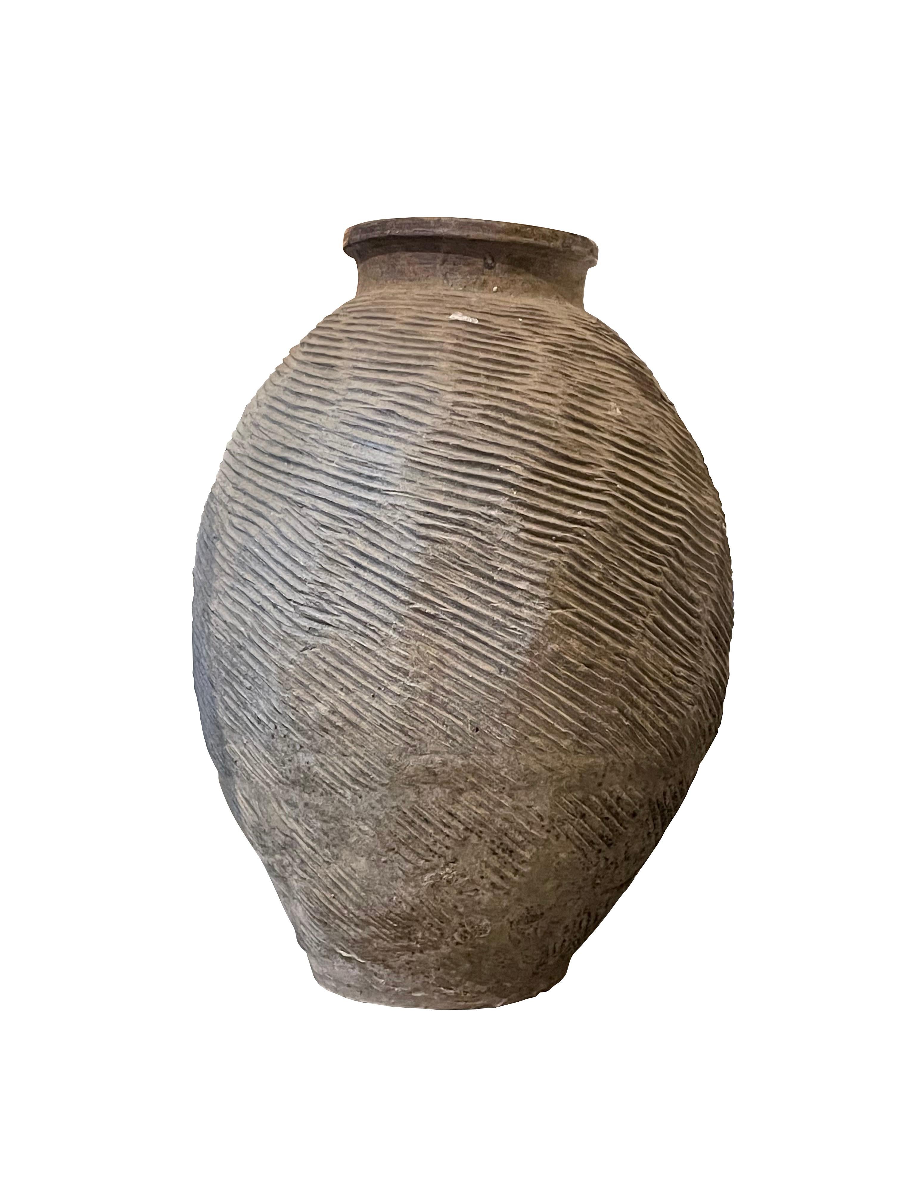 1940's Chinese horizontal raised rib texture vase.
Weathered brown color.