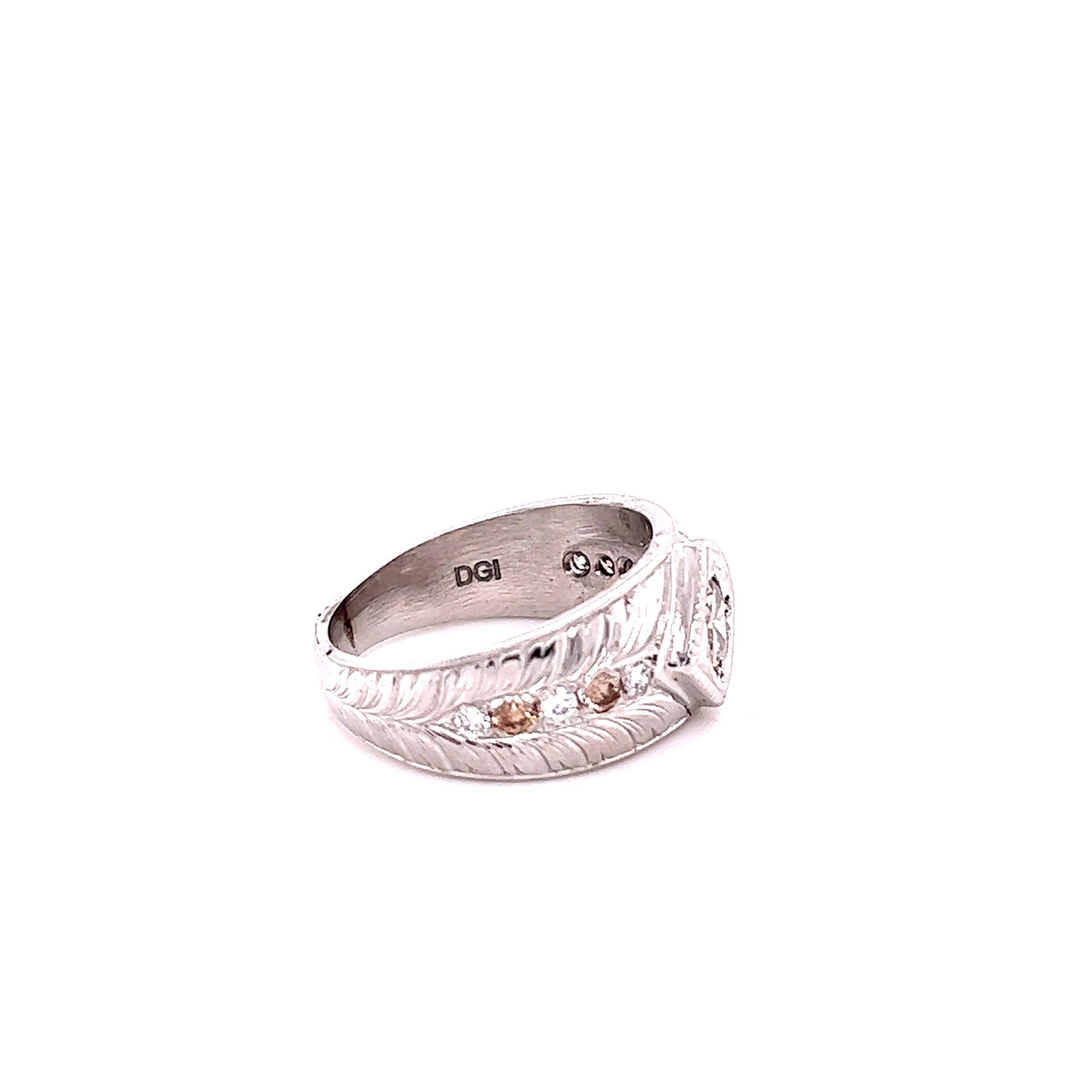 This band has a Natural Champagne Diamond that weighs 0.50 carats and has 10 Champagne Diamonds and White Diamonds on the sides of the ring that weigh 0.40 carats. The total carat weight of the ring is 0.90 carats. 
Curated in 14 Karat White Gold