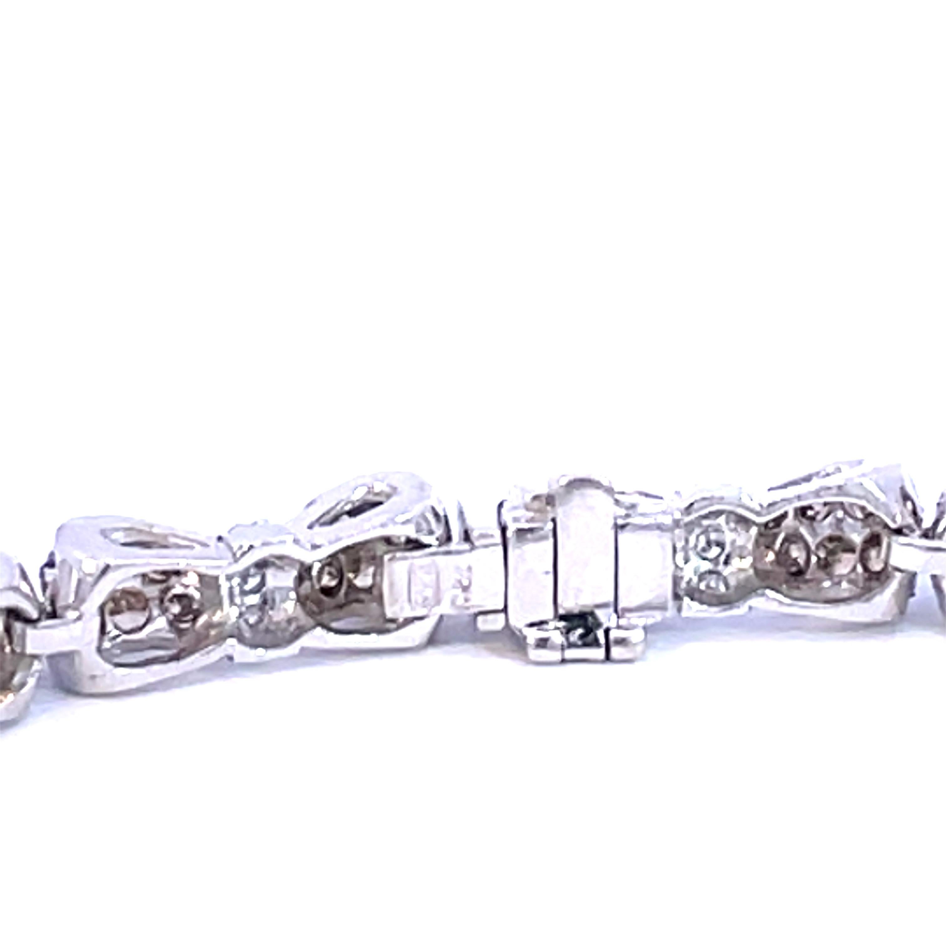 An Beautiful Bow Tie Bracelet set with natural brown diamonds and natural white diamonds in 18kt white gold.

144 natural brown diamonds weighing 6.00ct total weight

36 natural white diamonds weighing 0.30ct total weight

18kt white gold, 18g