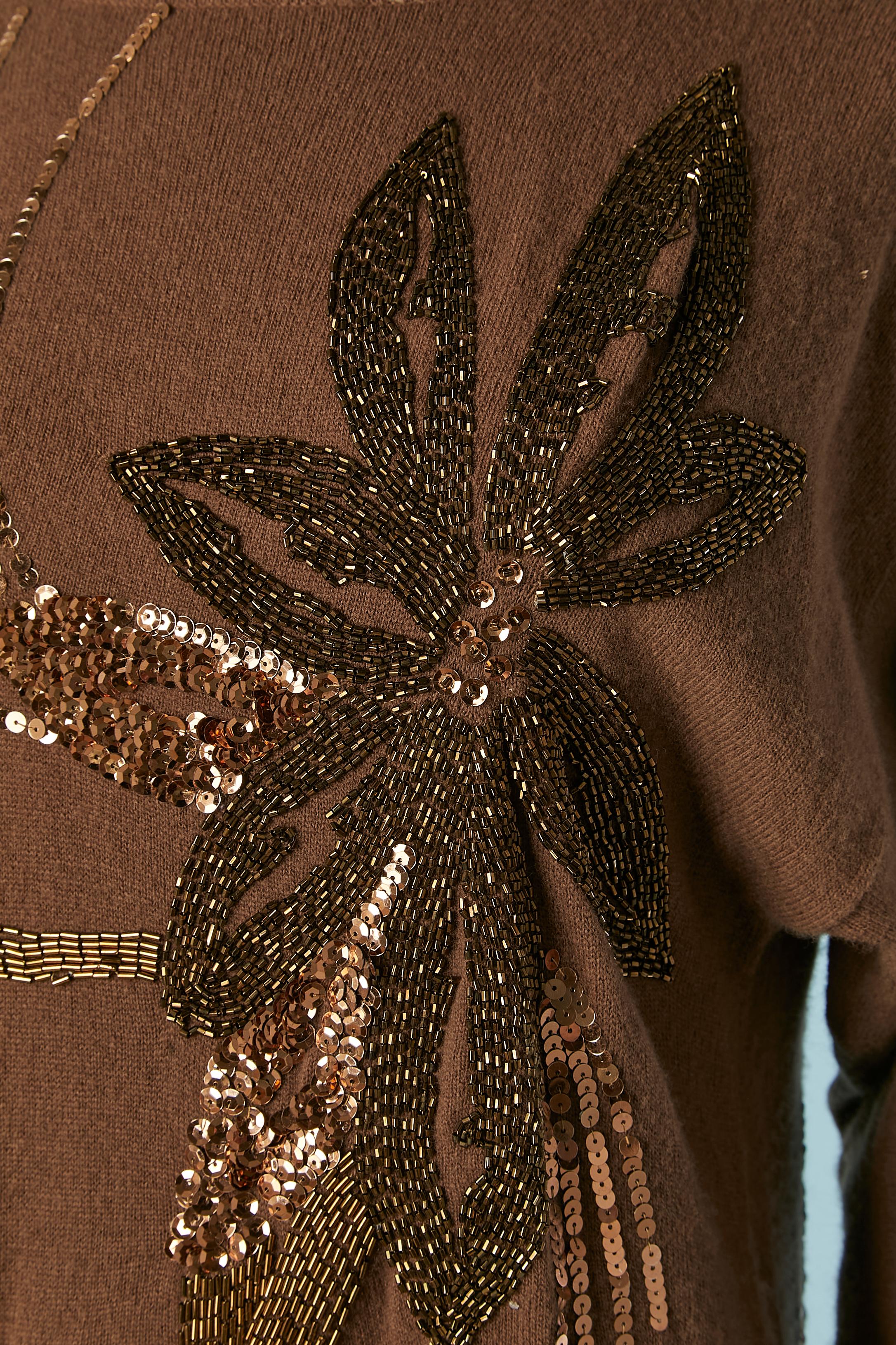 Brown wool knit dress with sequin and beads embroideries . 
SIZE M 