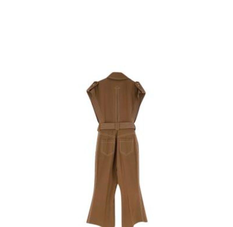 Zimmermann Brown Wool Twill Zippy Jumpsuit
 
 - Retro-inspired styling with contrasting topstich on a tobacco twill base
 - Point collar, sleeveless with kickflare trouser leg
 - Button front with adjustable belt
 - Safari-style patch pockets 
 
