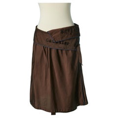 Brown wrap skirt with black writing on Gaultier Jeans 