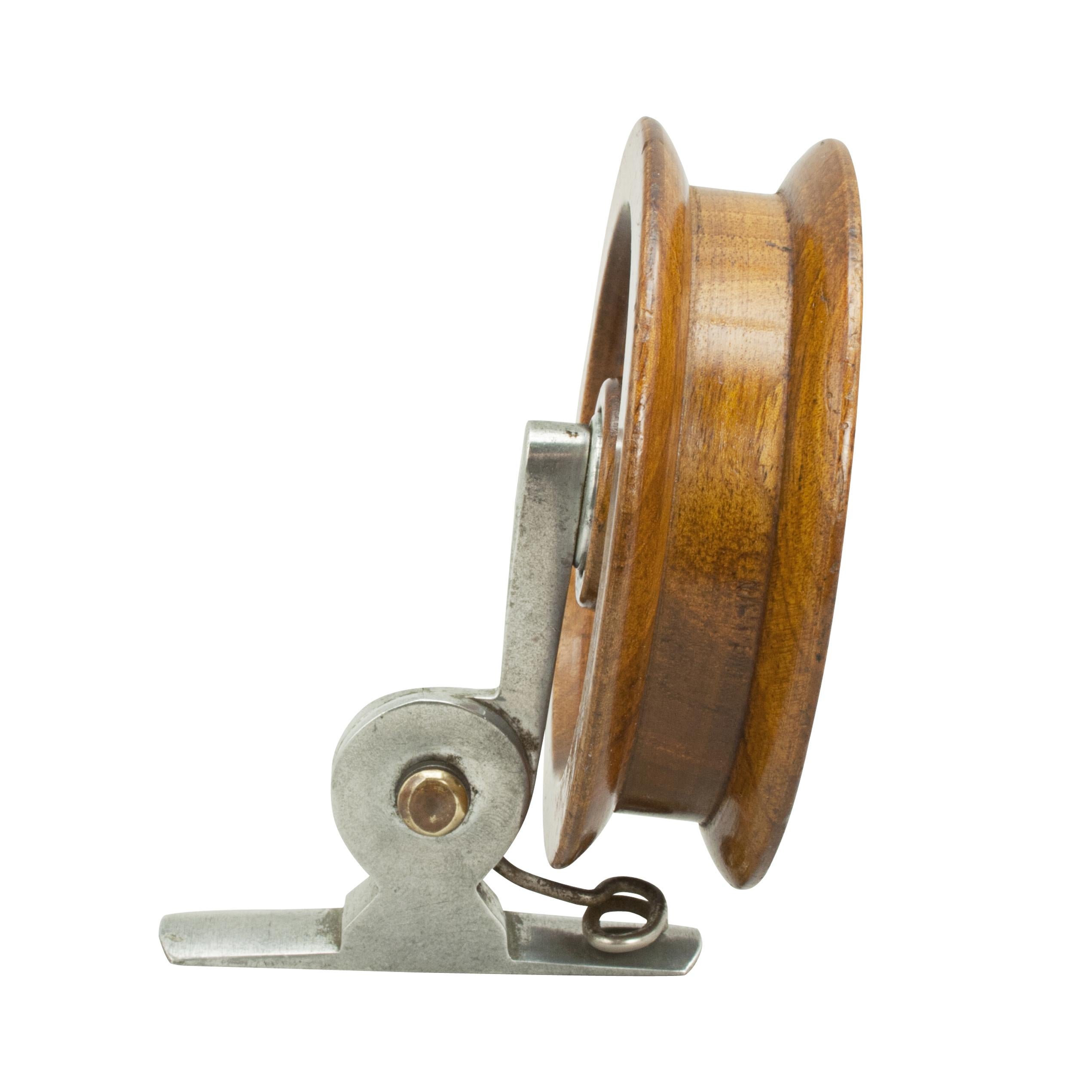 Brownie fishing reel by Millward. 1921 Patent sidecasting reel made from wood with aluminium and brass fittings. The reel stamped 'Millward The Brownie Pat. No. 193277/21'. The back stamped, 'Made in England'
This is a rare reel but the handle is