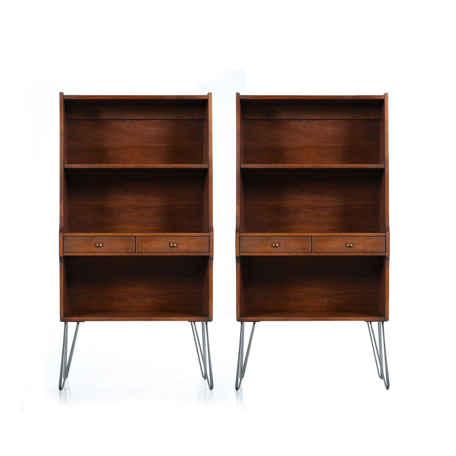 These three Broyhill Brasilia bookcases have been updated with stylish, heavy duty and period appropriate hairpin legs. The walnut wood veneer exhibits fiery grain walnut. The deep chocolate brown patina comes from decades of aging with loving care.