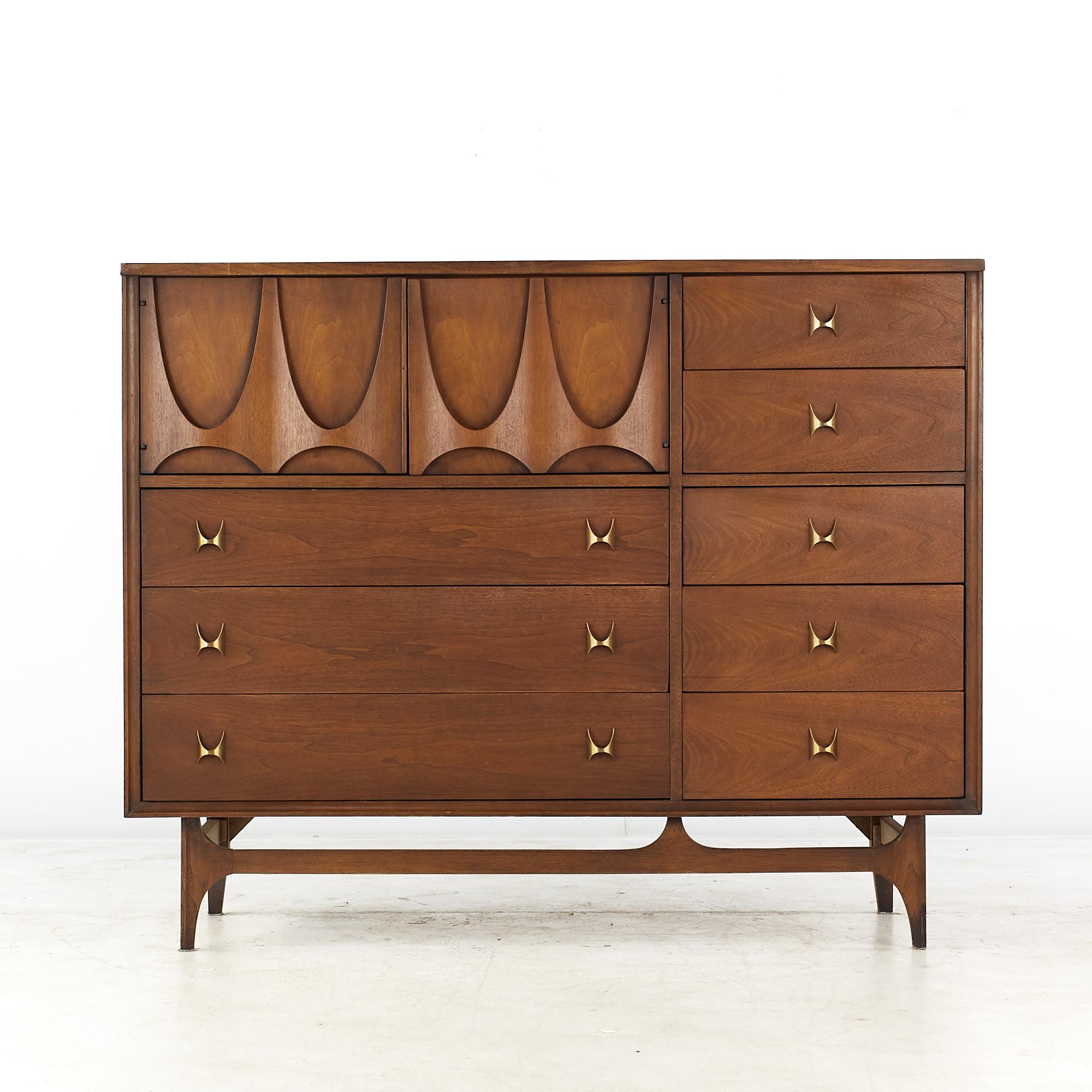 Broyhill Brasilia Brutalist Magna mid-century walnut dresser.

This dresser measures: 54 wide x 19 deep x 43.25 inches high.

All pieces of furniture can be had in what we call restored vintage condition. That means the piece is restored upon