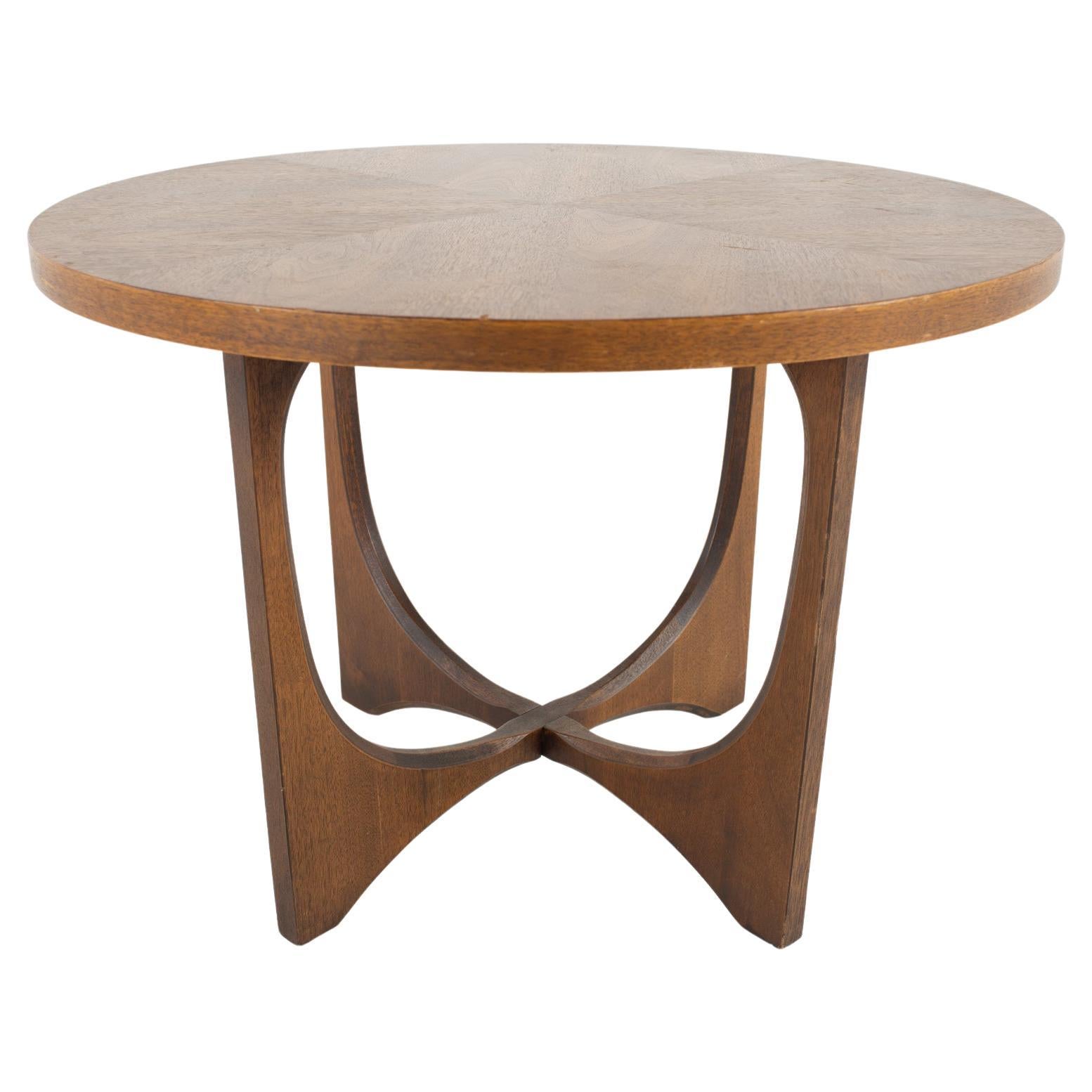Broyhill Brasilia Brutalist mid century round walnut side end table 

This end table measures: 28 wide x 28 deep x 20 inches high

All pieces of furniture can be had in what we call restored vintage condition. That means the piece is restored