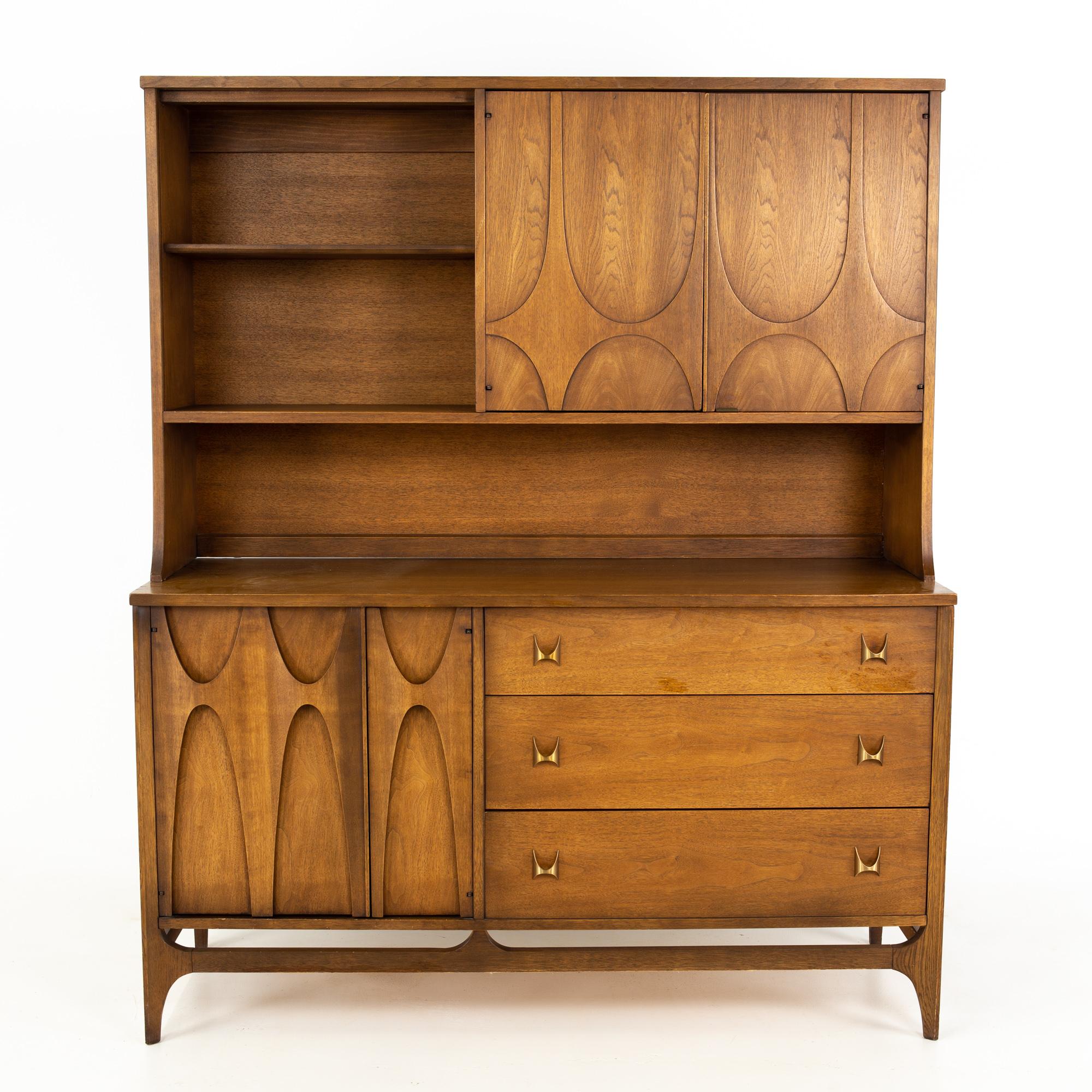 Broyhill Brasilia Brutalist mid-century walnut sideboard credenza buffet and Hutch

Buffet and hutch measures: 54 wide x 19 deep x 65 inches high

All pieces of furniture can be had in what we call restored vintage condition. That means the