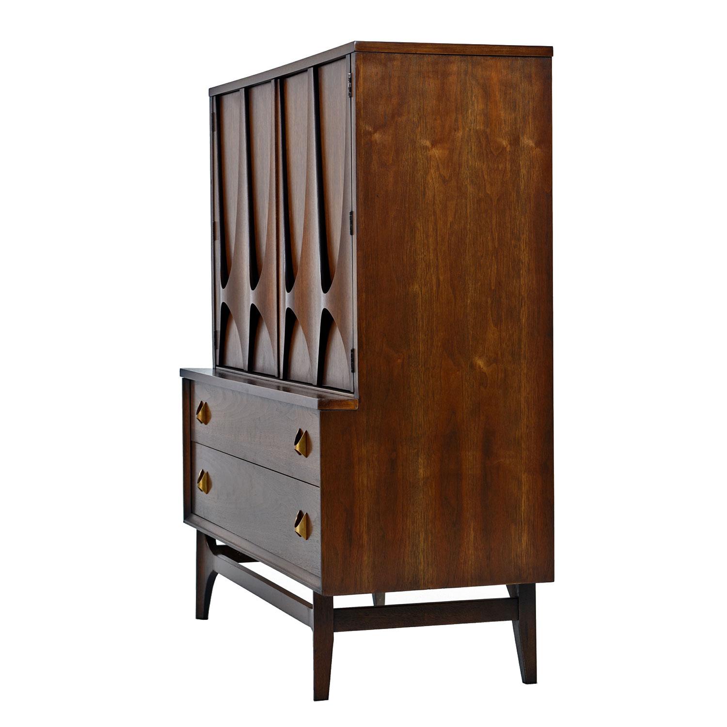Part of a complete bedroom set, this gentleman's dresser was delicately restored to preserve the original dark patina. We would find this dresser fairly often over the years, but Brasilia has elevated to a high-end status that has made them very