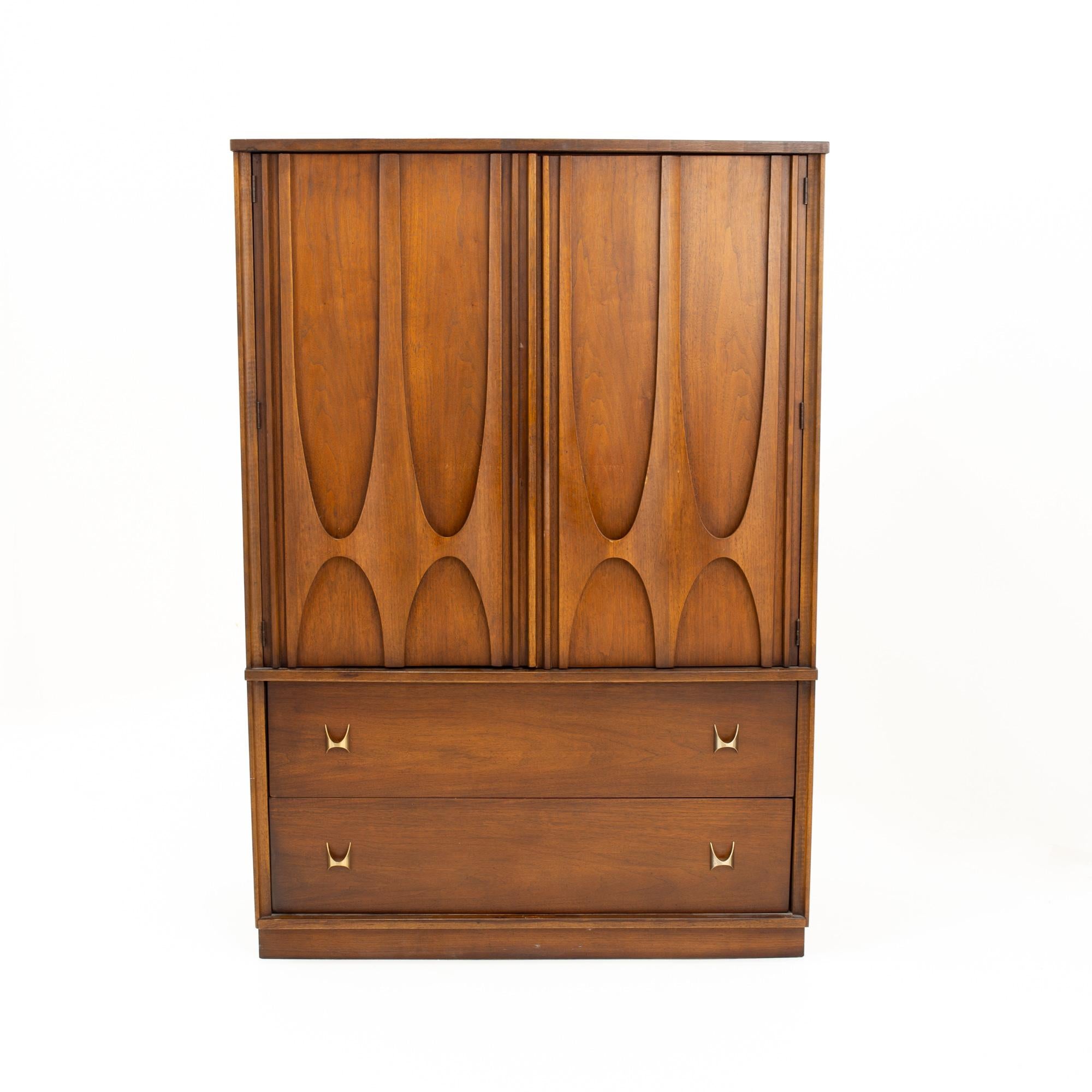 Broyhill Brasilia II Brutalist mid century walnut and brass armoire gentleman's chest
Chest measures: 40 wide x 19 deep x 58 inches high

All pieces of furniture can be had in what we call restored vintage condition. That means the piece is