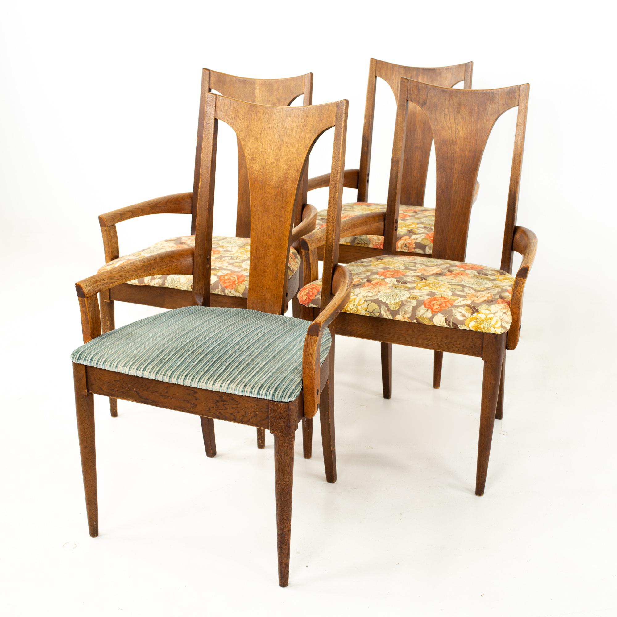 Broyhill Brasilia II mid century walnut captains dining chairs - set of 4
Each chair measures: 22.75 wide x 21 deep x 37 high, with a seat height of 18.25 inches  

All pieces of furniture can be had in what we call restored vintage condition.