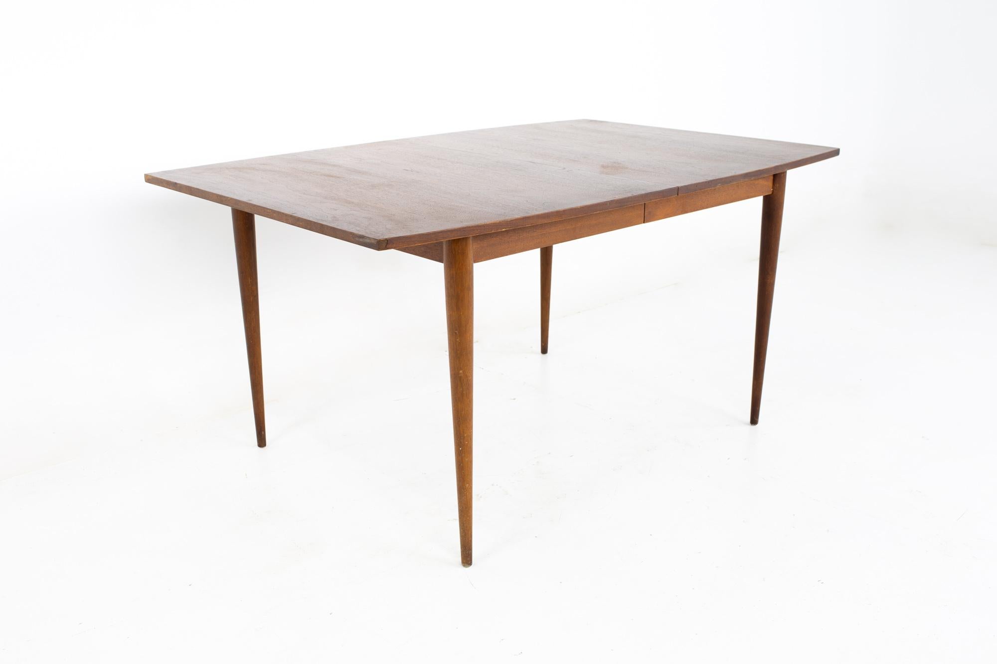 Broyhill Brasilia II mid century walnut dining table

This table measures: 60 wide x 40 deep x 30 high, with a chair clearance of 26 inches

All pieces of furniture can be had in what we call restored vintage condition. That means the piece is