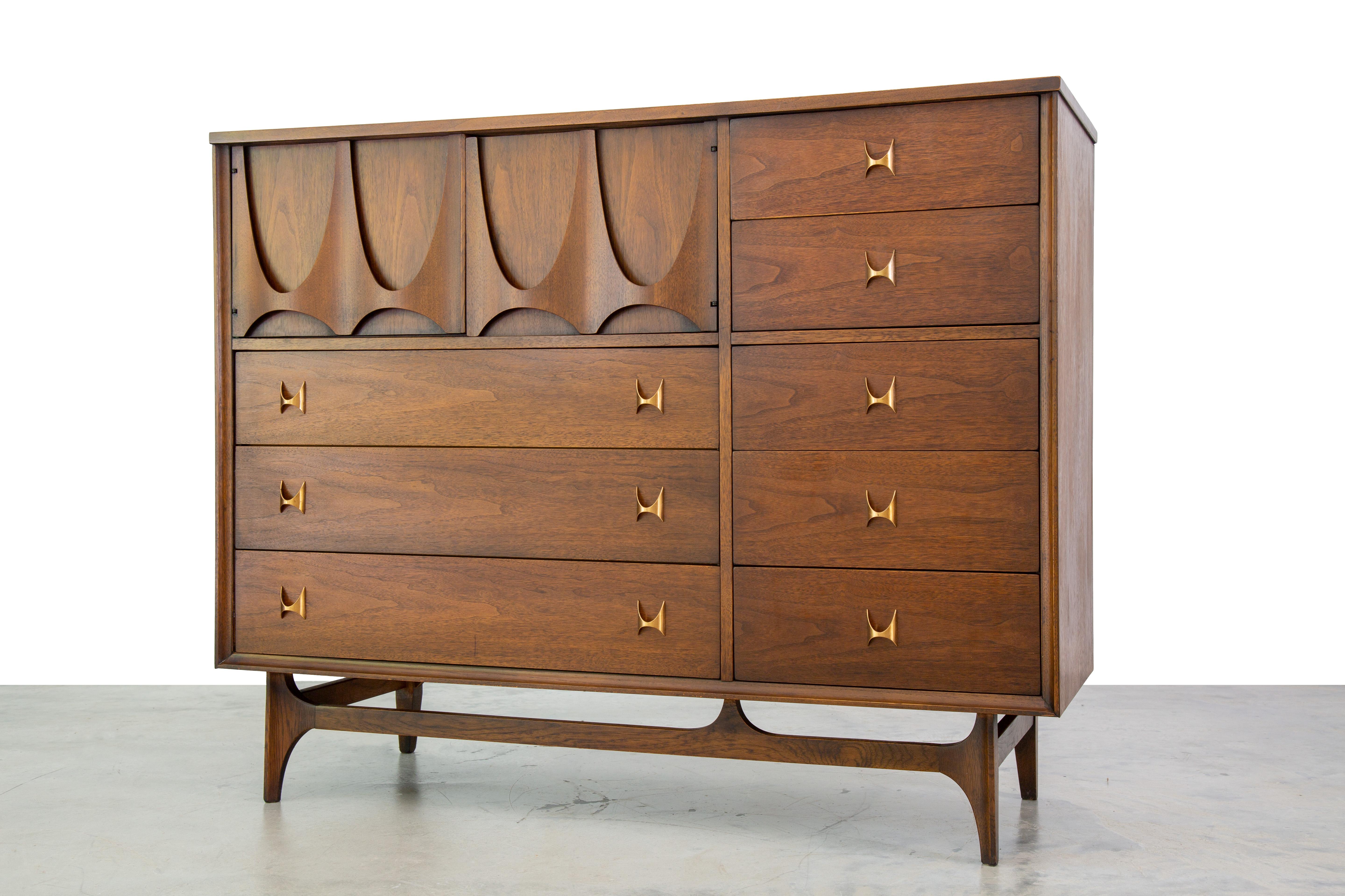 The magna chest in the Broyhill Brasilia line is one of the most coveted items of the mid century modern era. Plenty of storage can be found in the 8 drawers. Two doors on the upper left cancel a compartment with two dividers that offer even more