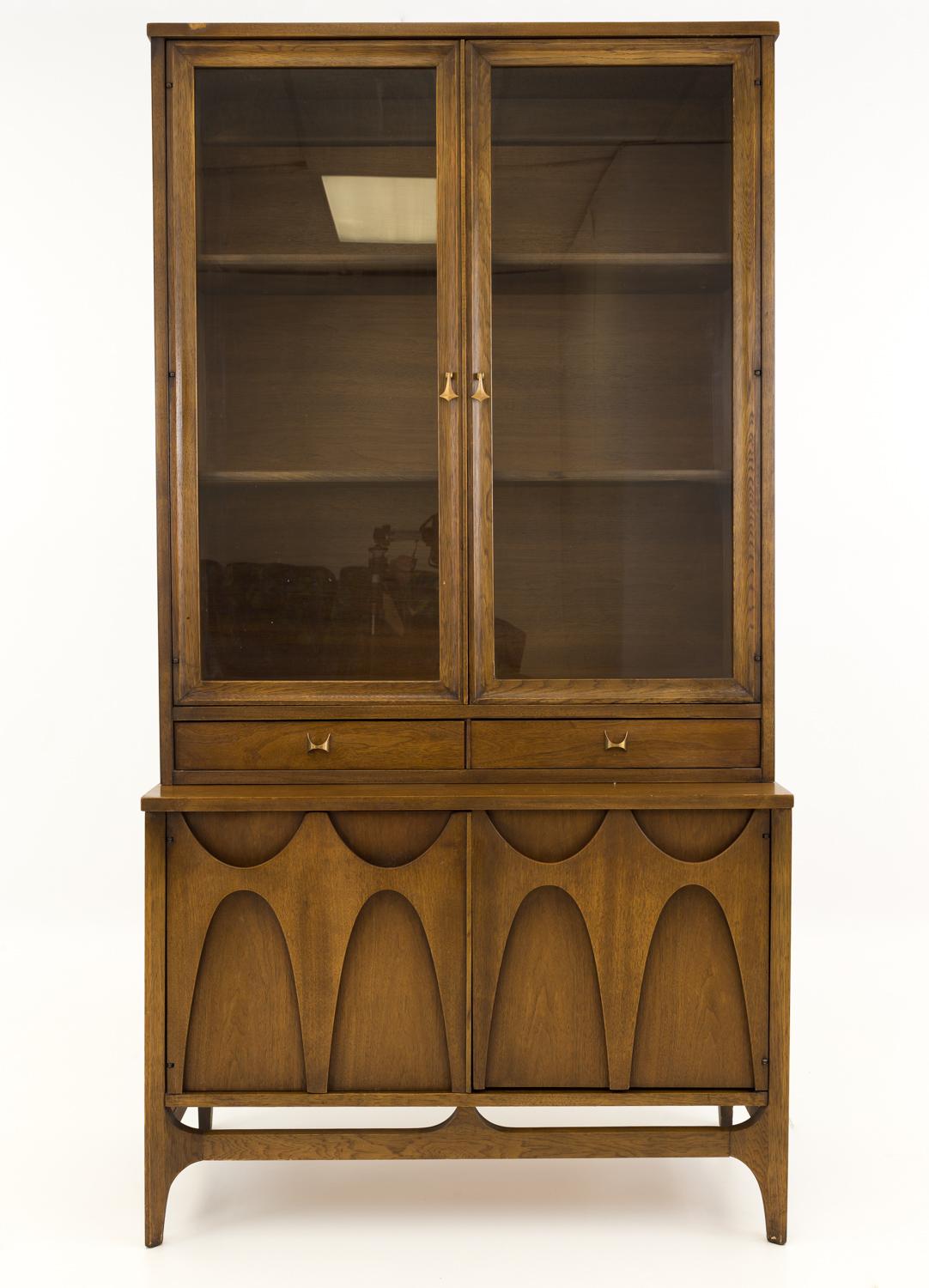 Broyhill Brasilia mid century buffet China cabinet

This china cabinet measures: 37 wide x 17 deep x 26 high without hutch and the hutch itself is 36.5 wide x 12.5 deep x 48 high for a total overall height of 74 inches

All pieces of furniture