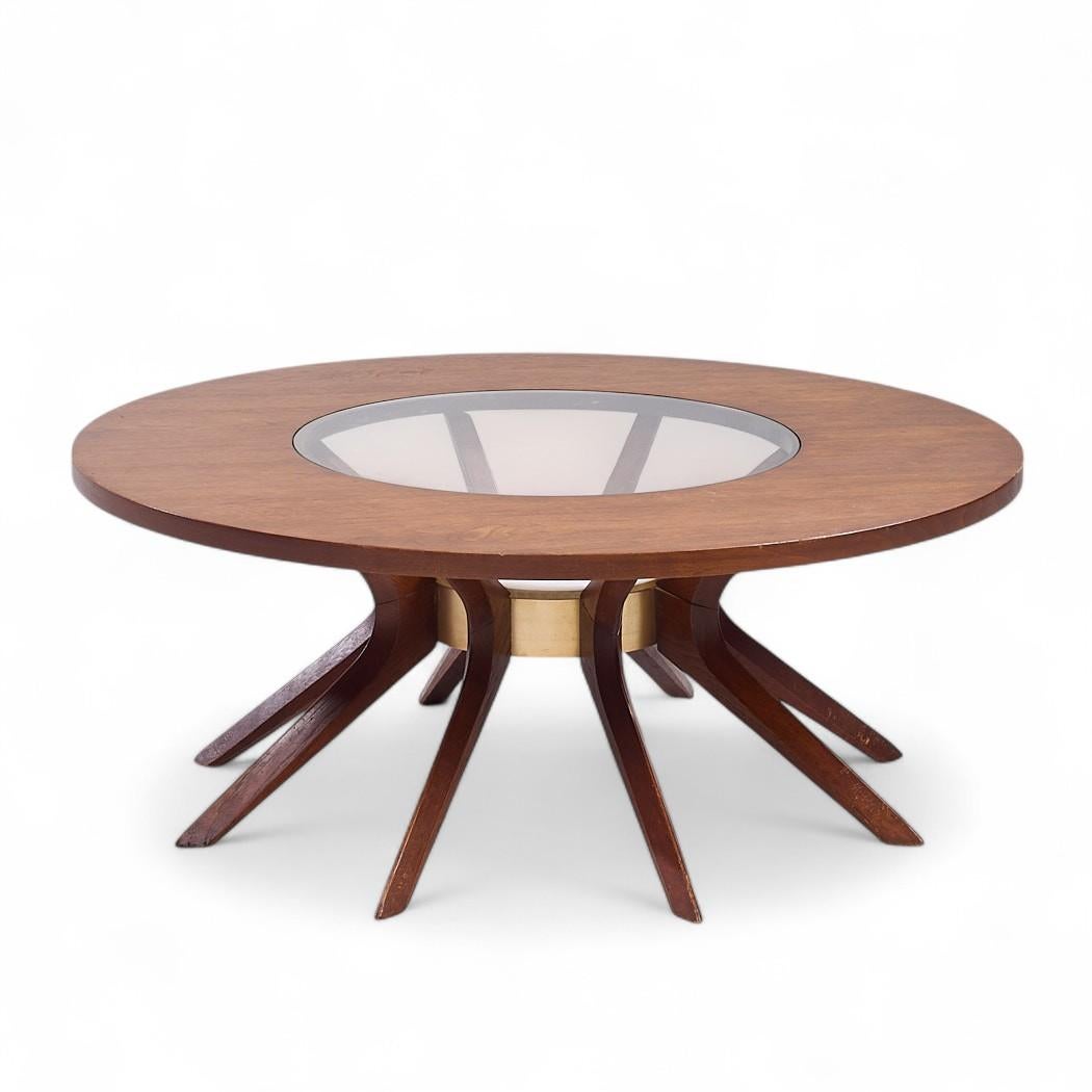 Broyhill Brasilia Mid Century Cathedral Walnut Coffee Table

This coffee table measures: 40 wide x 40 deep x 16 inches high

All pieces of furniture can be had in what we call restored vintage condition. That means the piece is restored upon