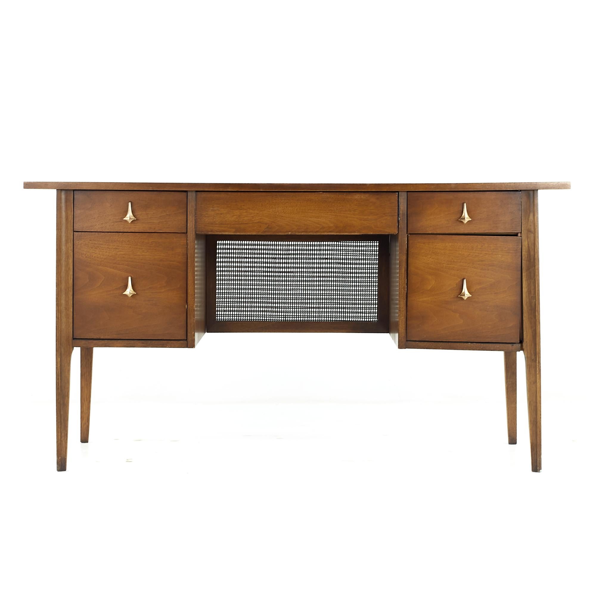 Broyhill Brasilia midcentury Desk Walnut and Brass Desk

This desk measures: 56 wide x 23 deep x 30 high, with a chair clearance of 24.5 inches

All pieces of furniture can be had in what we call restored vintage condition. That means the piece