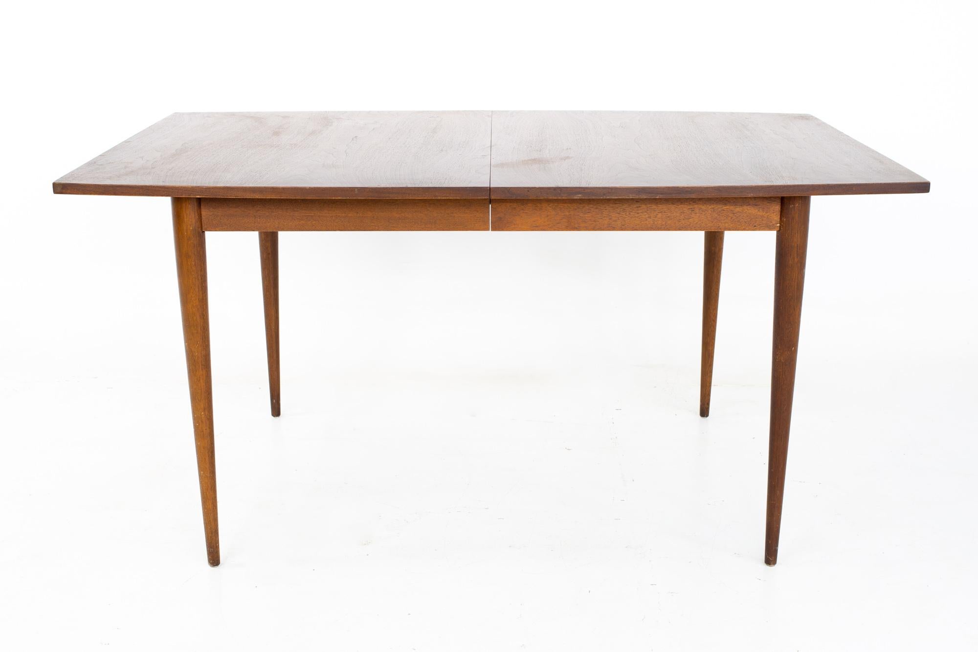 Broyhill Brasiliamid century dining table - no leaf

This table measures: 60.5 wide x 40 deep x 29.5 inches, with a chair clearance of 25.5 inches 

All pieces of furniture can be had in what we call restored vintage condition. That means the