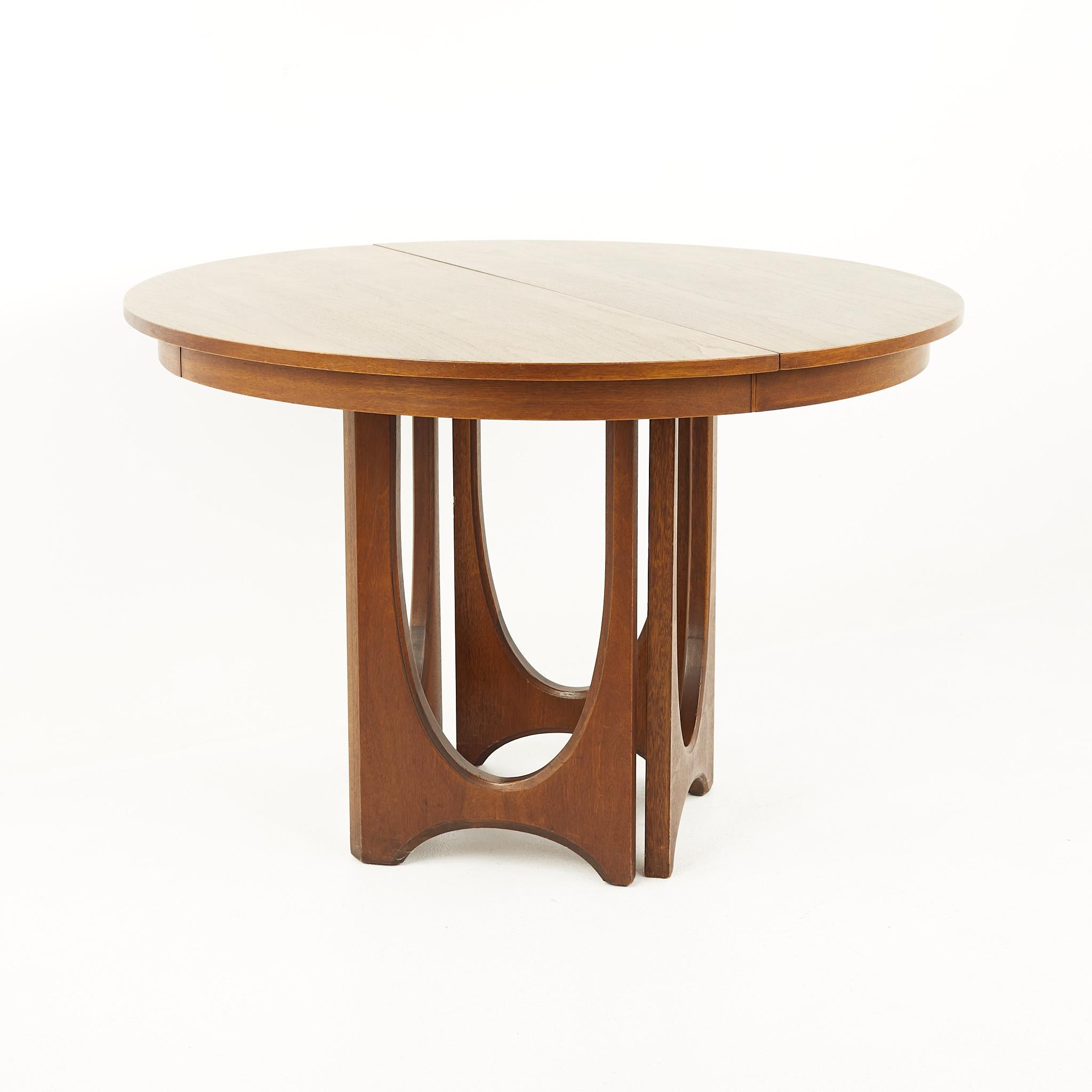 Broyhill Brasilia Mid Century Round Walnut Pedestal Dining Table - 2 Leaves

This table measures: 44 wide x 44 deep x 30 inches high, each leaf is 12.25 wide, making a maximum table width of 68.5 inches

All pieces of furniture can be had in