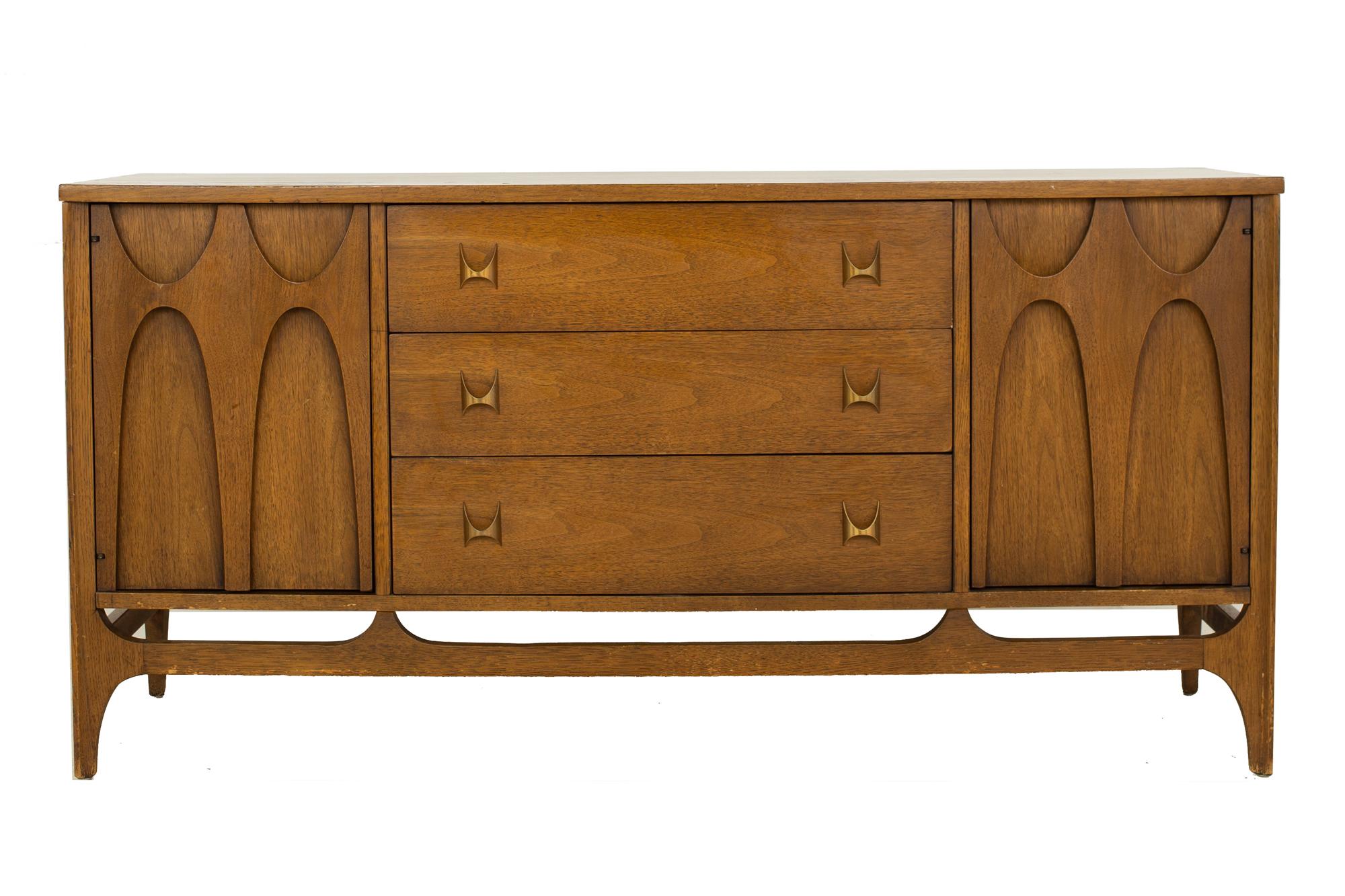 Broyhill Brasilia mid century sideboard buffet credenza

This credenza is: 66 wide x 19 deep x 30.75 inches high

All pieces of furniture can be had in what we call restored vintage condition. That means the piece is restored upon purchase so