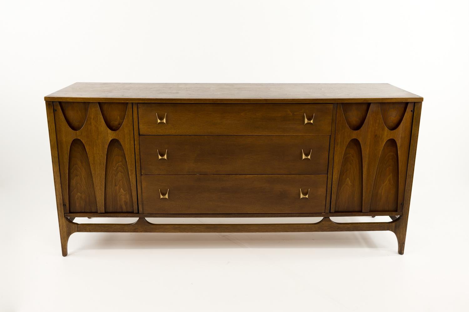 Broyhill Brasilia mid century sideboard buffet credenza

This credenza is: 66 wide x 19 deep x 30.75 inches high

All pieces of furniture can be had in what we call restored vintage condition. That means the piece is restored upon purchase so