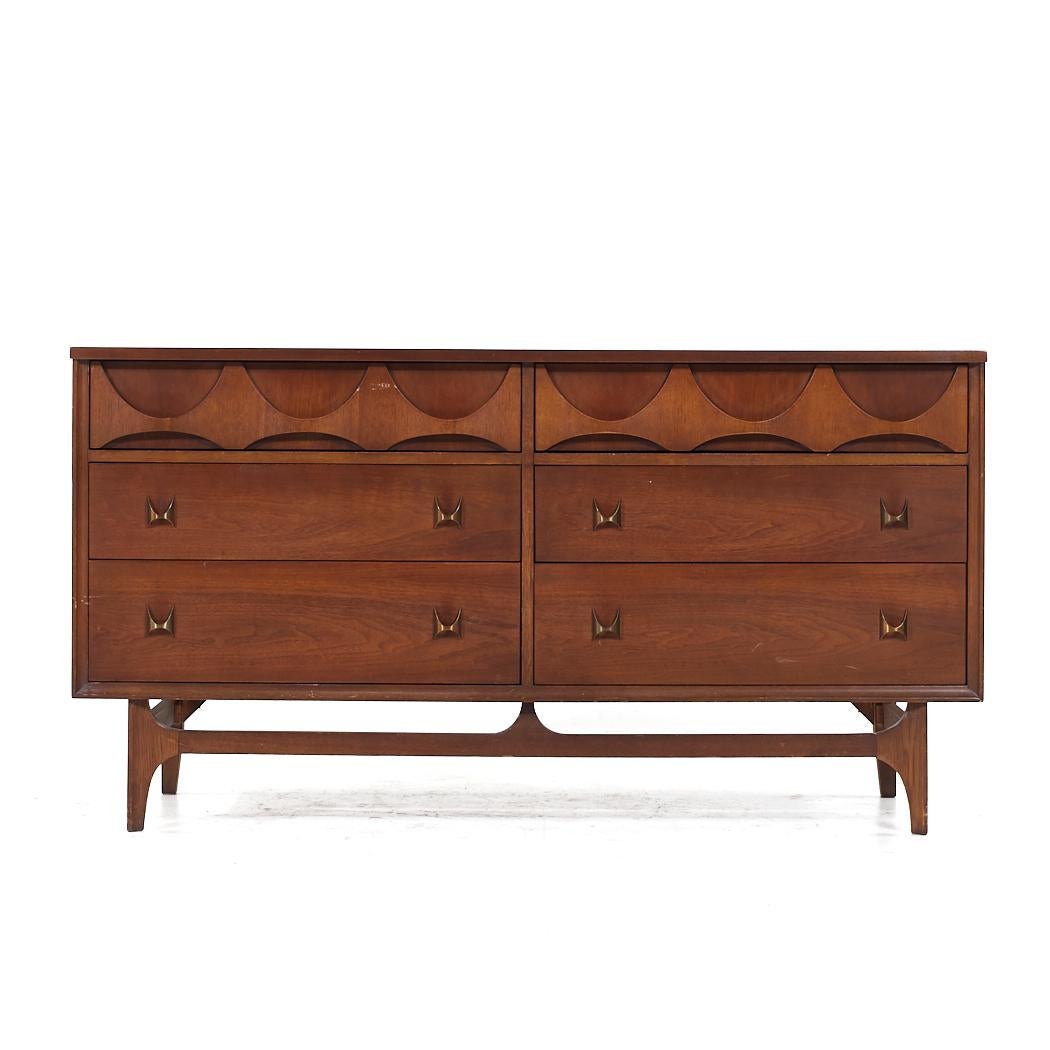 Broyhill Brasilia Mid Century Walnut 6 Drawer Lowboy Dresser

This dresser measures: 58 wide x 19 deep x 31 inches high

All pieces of furniture can be had in what we call restored vintage condition. That means the piece is restored upon purchase so