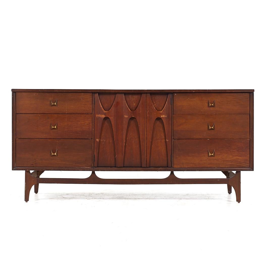 Broyhill Brasilia Mid Century Walnut 9 Drawer Dresser

This lowboy measures: 66 wide x 19 deep x 31 inches high

All pieces of furniture can be had in what we call restored vintage condition. That means the piece is restored upon purchase so it’s