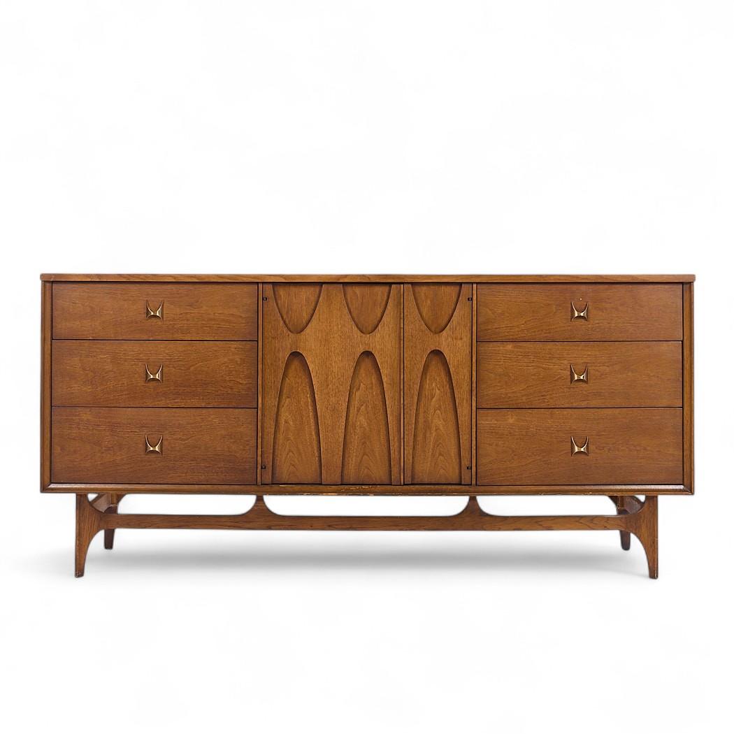 Broyhill Brasilia Mid Century Walnut 9-Drawer Lowboy Dresser

This lowboy measures: 66 wide x 19 deep x 31 inches high

All pieces of furniture can be had in what we call restored vintage condition. That means the piece is restored upon purchase so