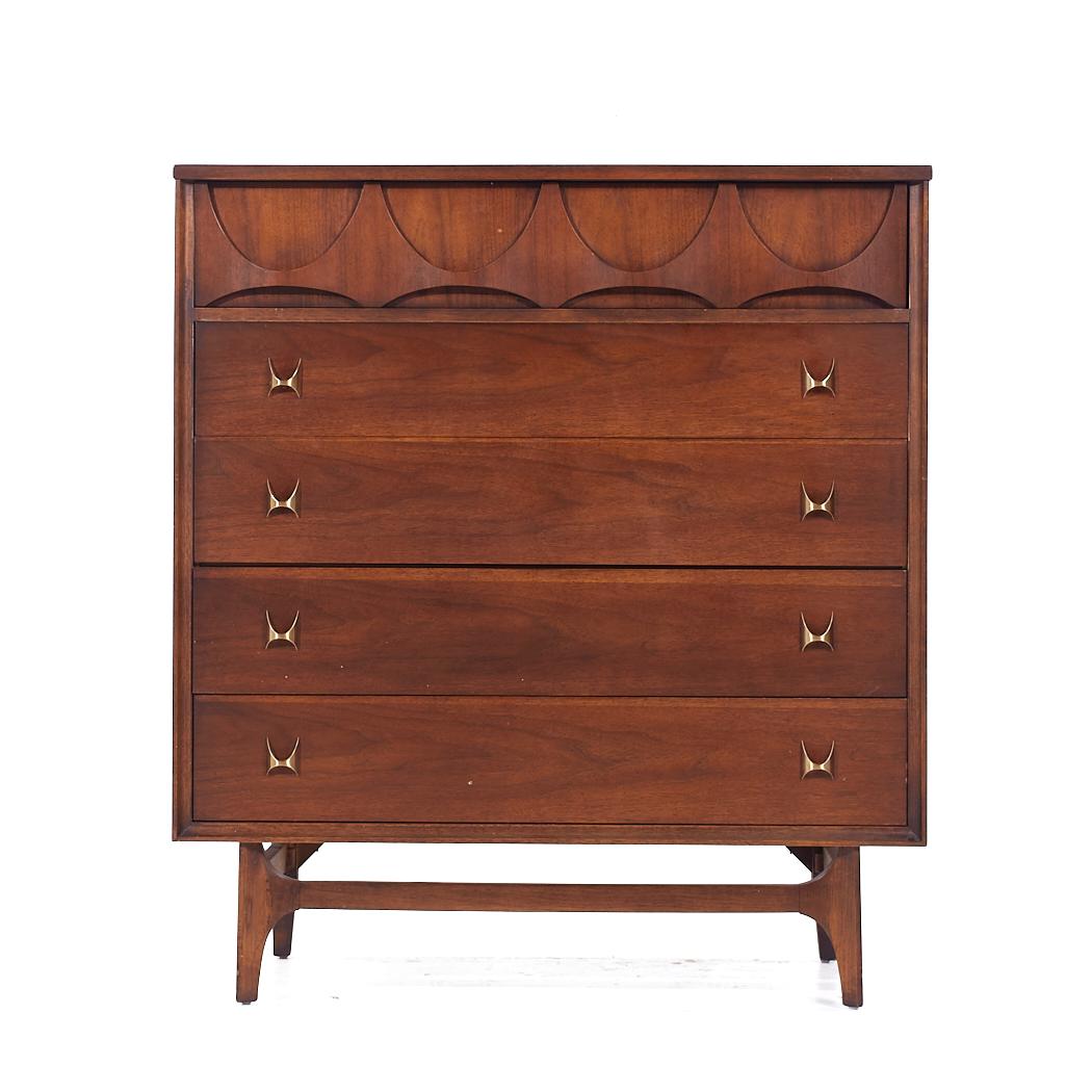 Broyhill Brasilia Mid Century Walnut and Brass 5 Drawer Highboy Dresser

This highboy measures: 40 wide x 19 deep x 44.5 inches high

All pieces of furniture can be had in what we call restored vintage condition. That means the piece is restored