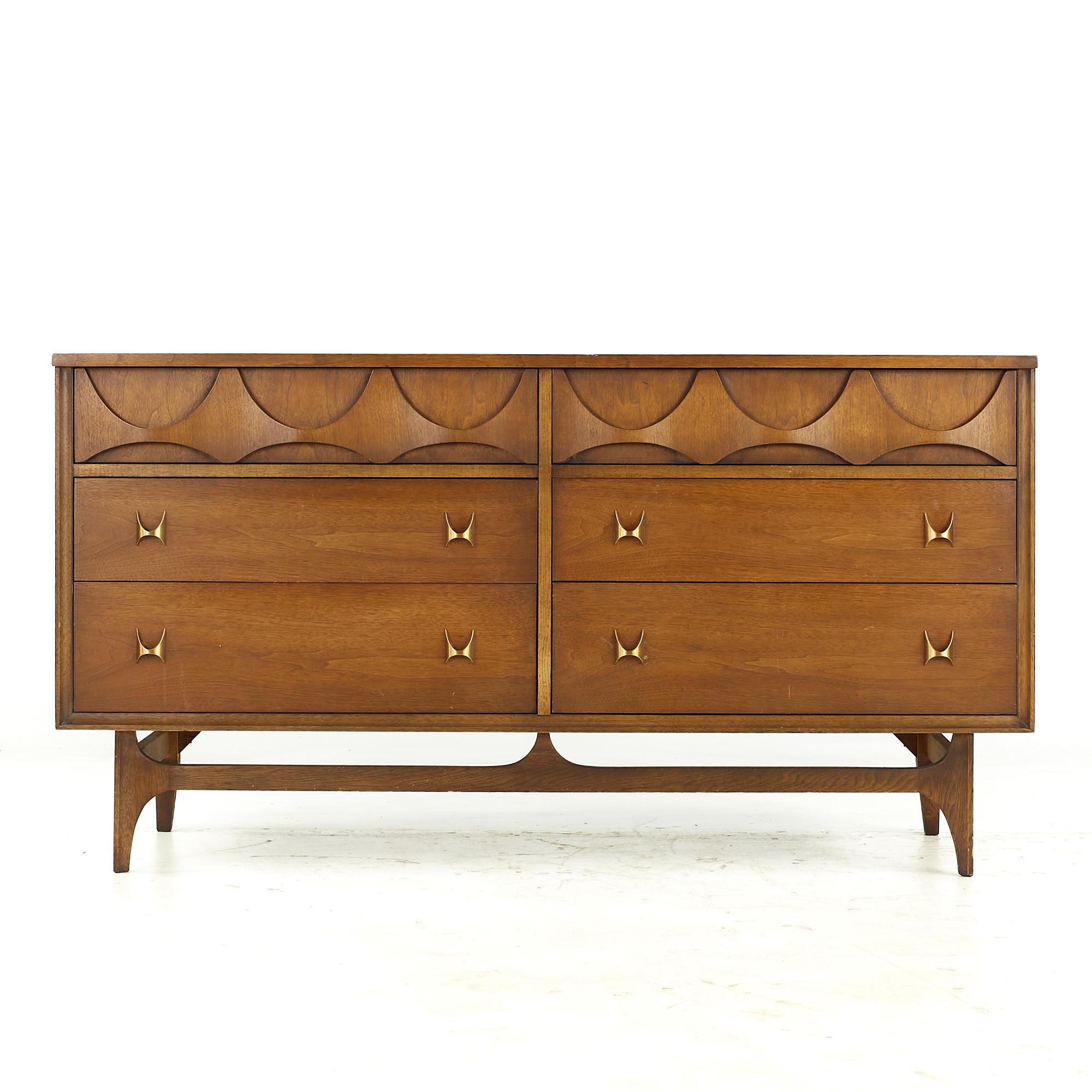 Broyhill Brasilia midcentury Walnut and Brass 6 Drawer Dresser.

This lowboy measures: 58 wide x 19 deep x 31 inches high

All pieces of furniture can be had in what we call restored vintage condition. That means the piece is restored upon
