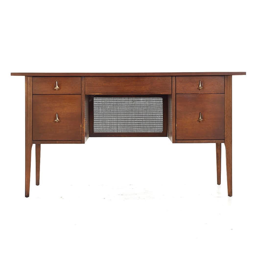 Broyhill Brasilia Mid Century Walnut and Brass Desk

This desk measures: 56 wide x 23 deep x 30 high, with a chair clearance of 24.5 inches

All pieces of furniture can be had in what we call restored vintage condition. That means the piece is