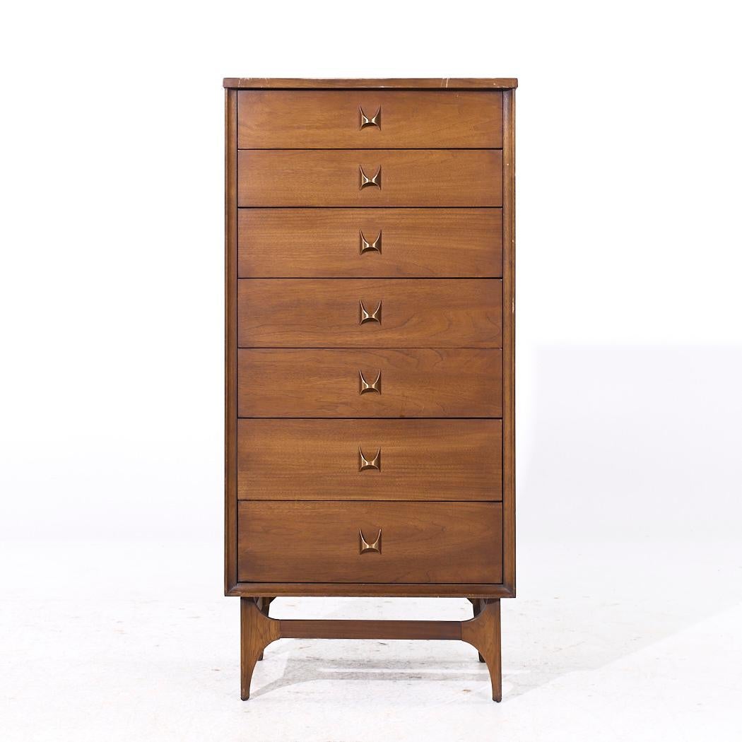 Broyhill Brasilia Mid Century Walnut and Brass Lingerie Chest

This chest measures: 24 wide x 16 deep x 51 high

All pieces of furniture can be had in what we call restored vintage condition. That means the piece is restored upon purchase so it’s