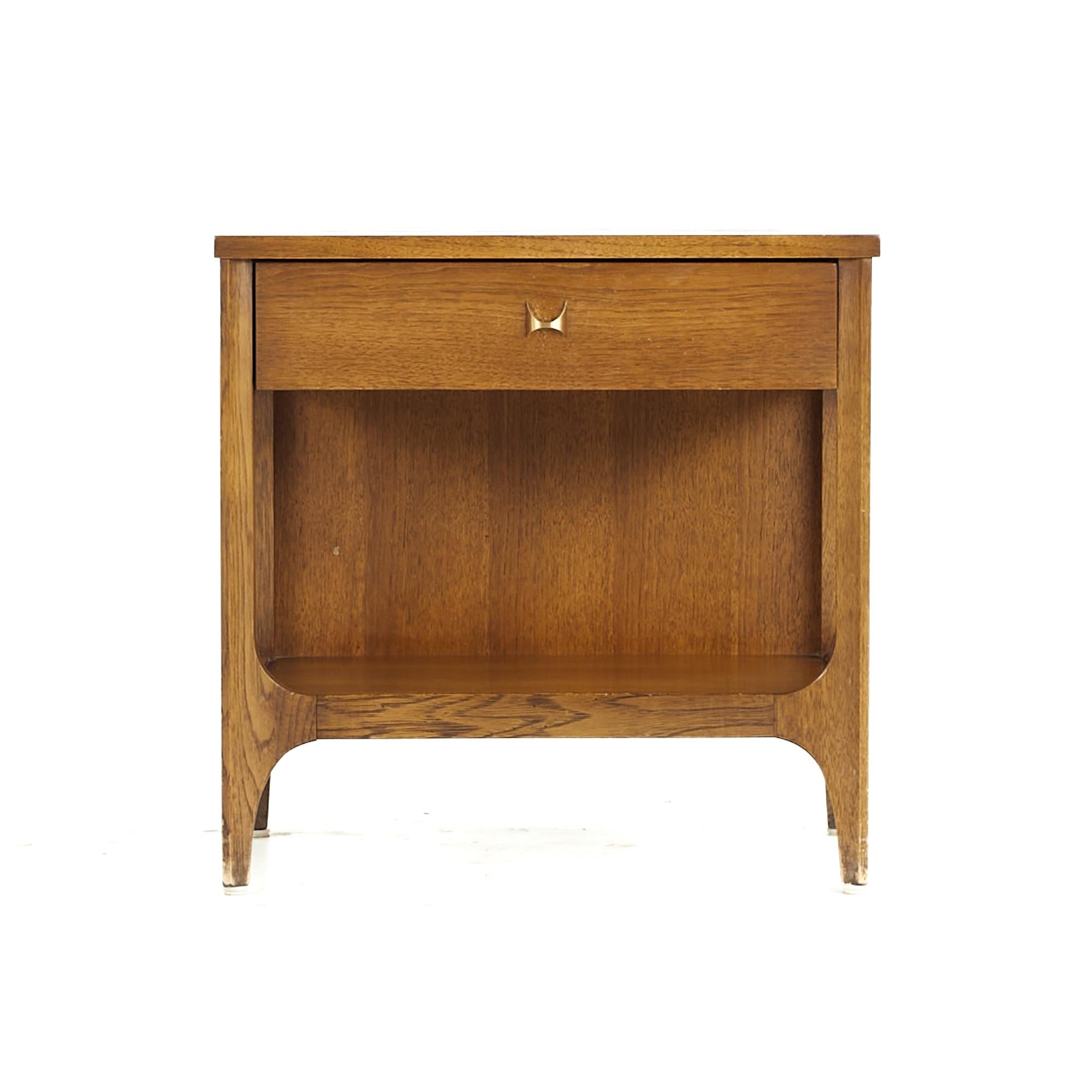 Broyhill Brasilia Mid Century Walnut and Brass Nightstand

This nightstand measures: 22.25 wide x 15 deep x 22.25 inches high

All pieces of furniture can be had in what we call restored vintage condition. That means the piece is restored upon